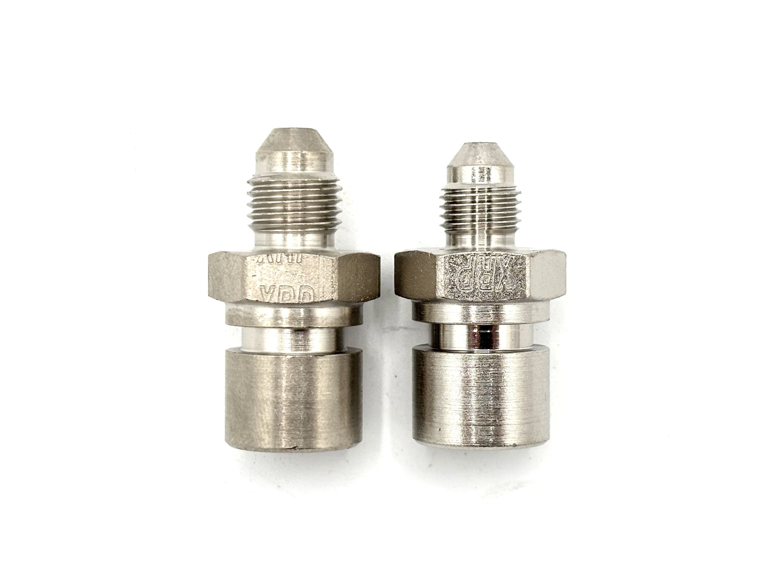 XRP AN male to 3/8-24 female steel inverted flare brake adapter. Silver in color. Various sizes from largest to smallest, left to right.