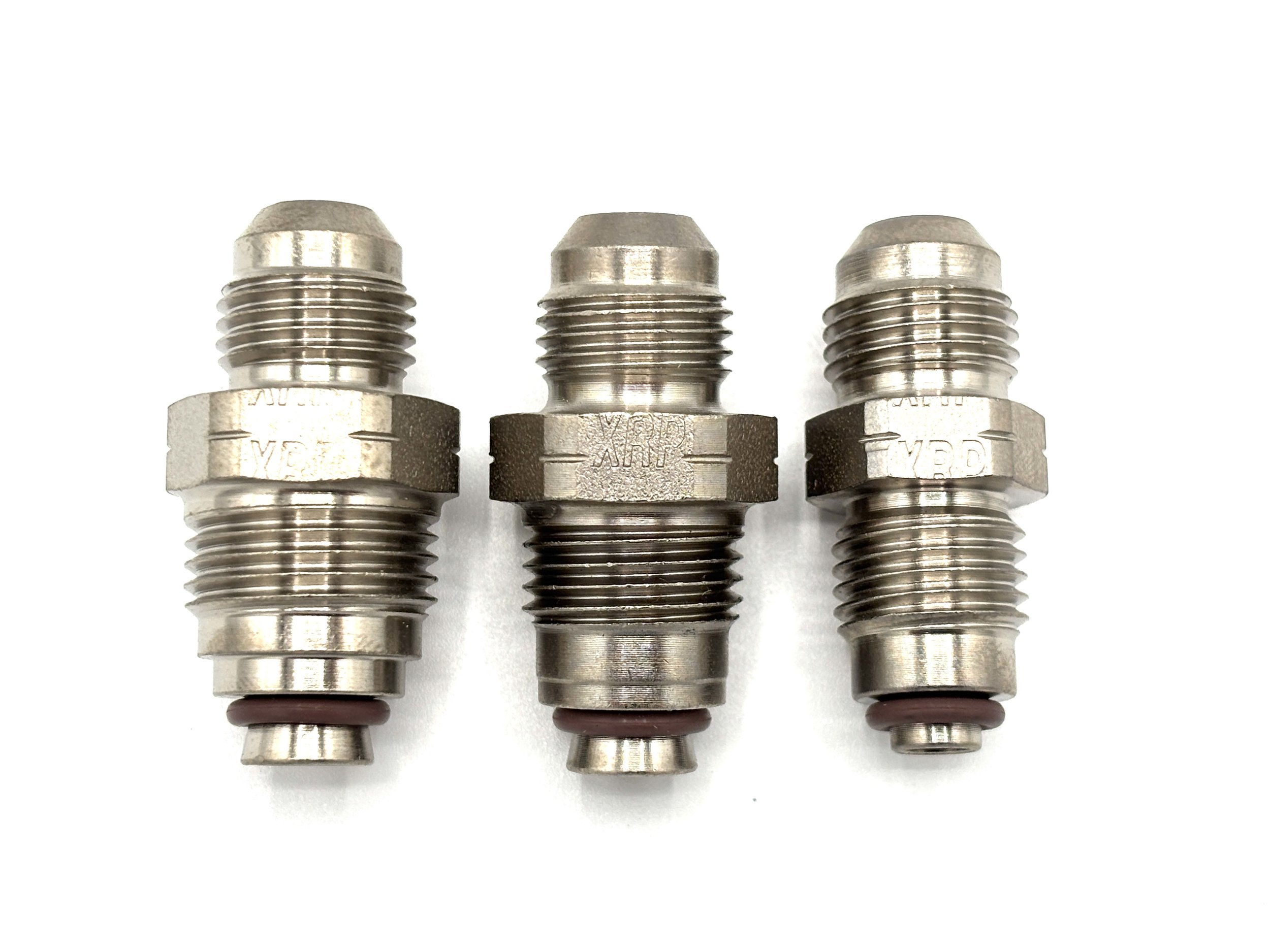 XRP straight -6AN steel bump tube adapter. Silver in color. Various sizes from largest to smallest, left to right.