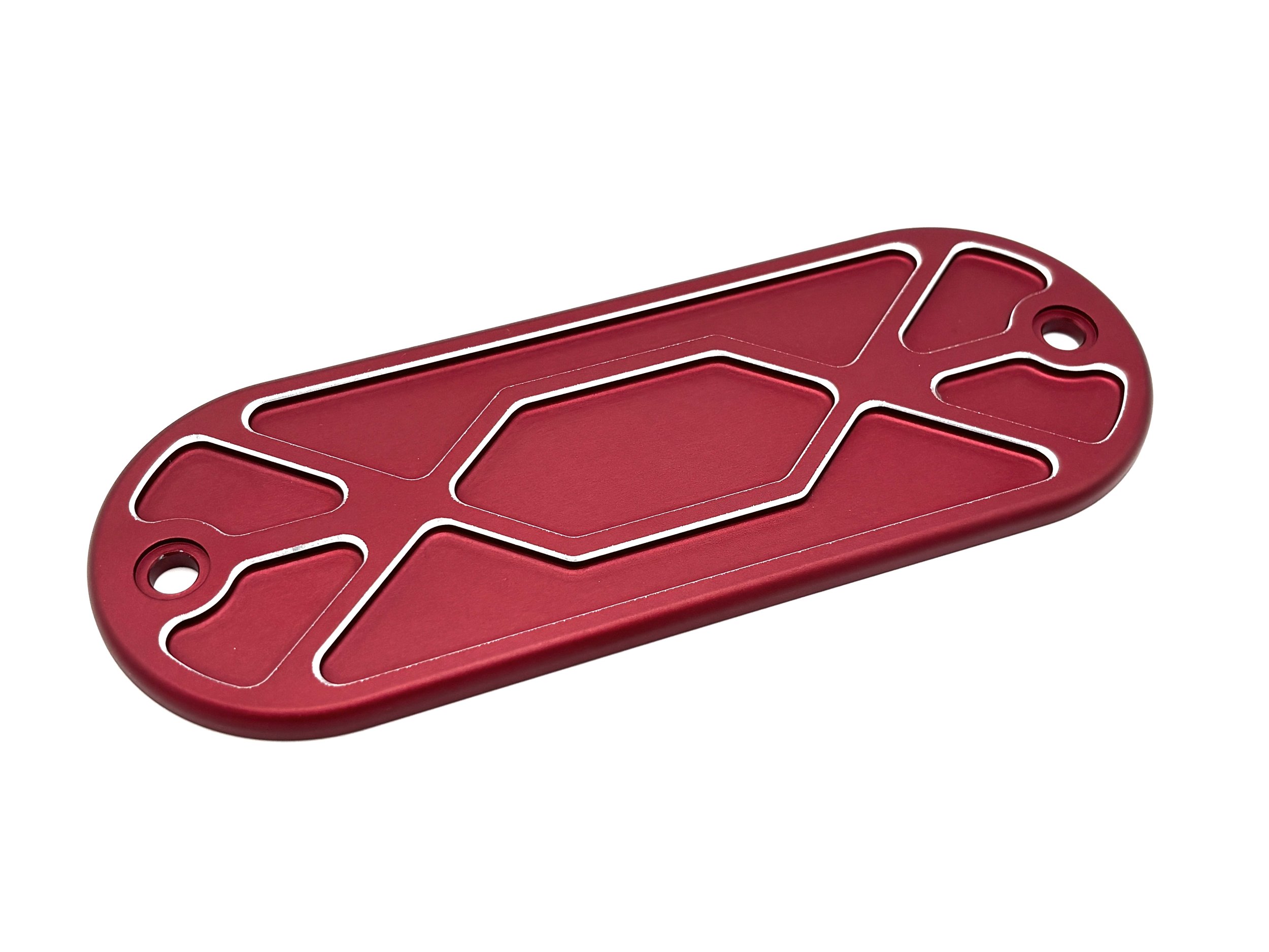 F2 VW Shifter Cover Large. Red Exterior, has Silver color highlights on the chamfer of the bosses in the part. Rectangle shape with radiuses on the ends and a counter sunk hole in the middle.