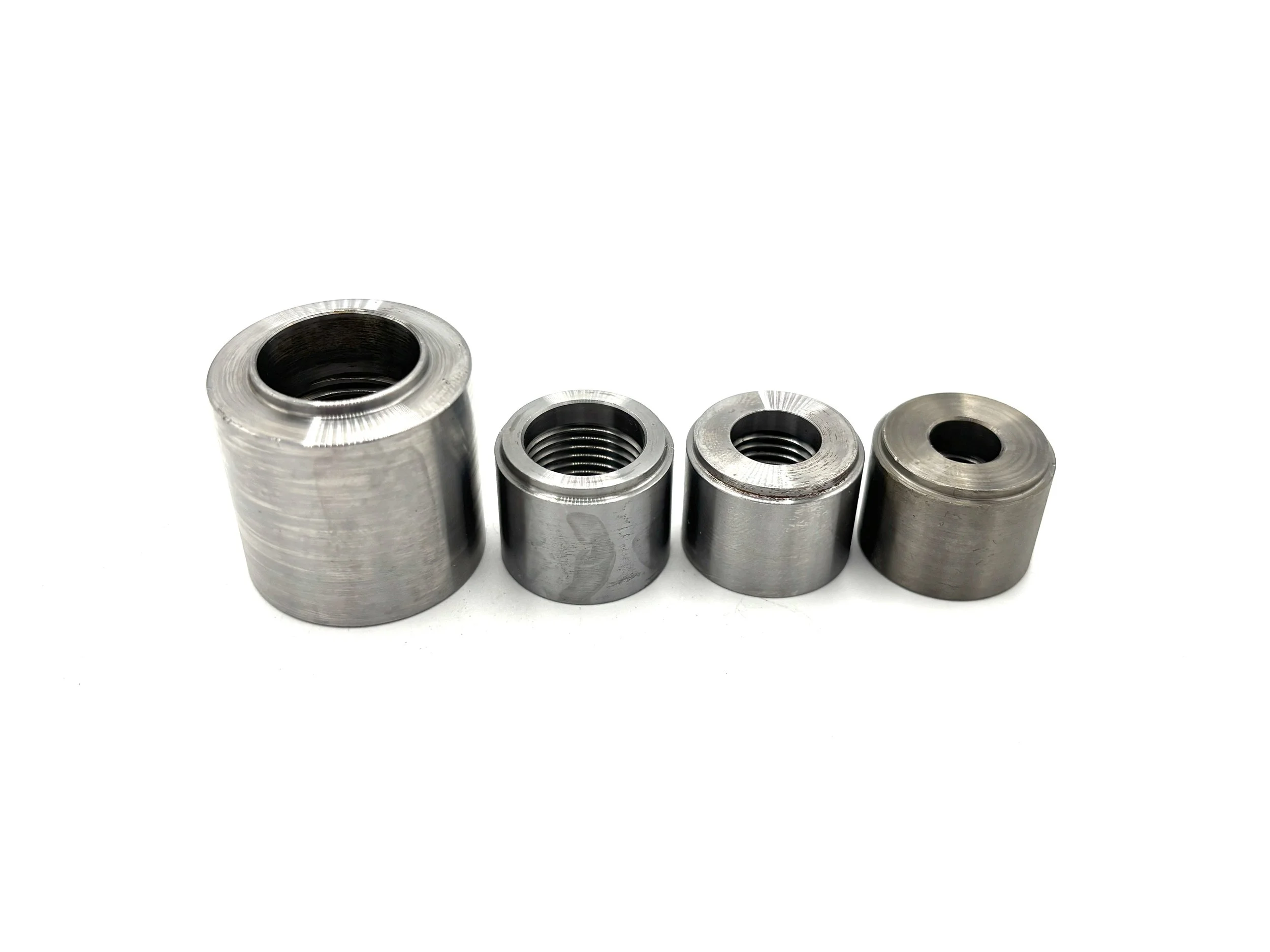 Earl's NPT Female Steel Weld Bung. Silver in color. Various sizes from largest to smallest, left to right.