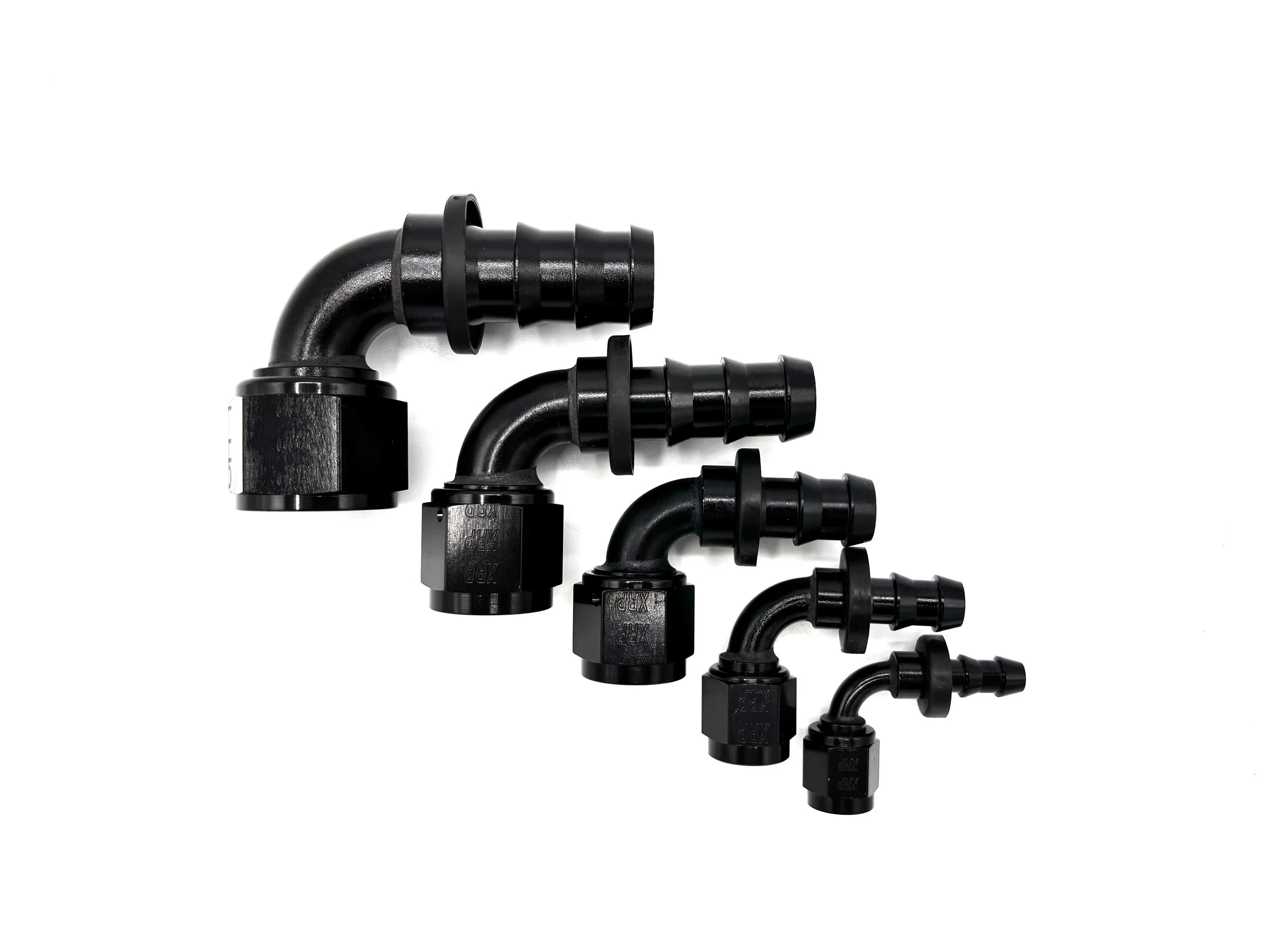 Five 90 Deg. Push Lock Hose End to AN Female fittings black. The bends are going towards the right. They are arranged in a line from largest to smallest.