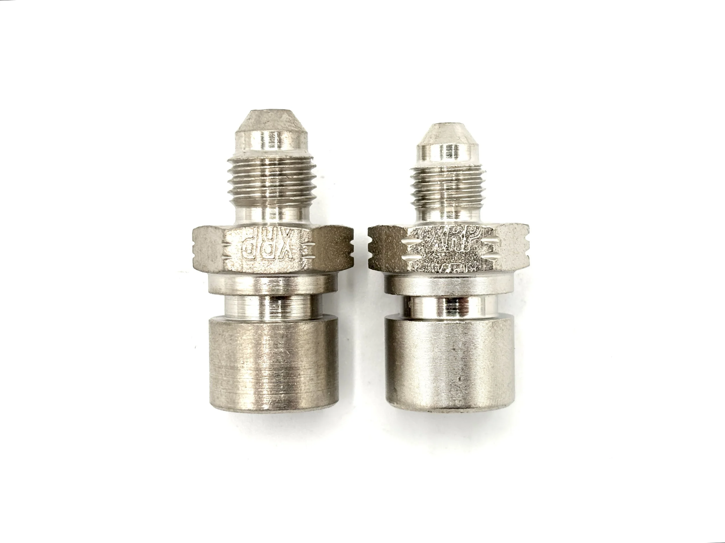 XRP AN male to M10 x 1.25 female steel inverted flare brake adapter. Silver in color. Various sizes from largest to smallest, left to right.