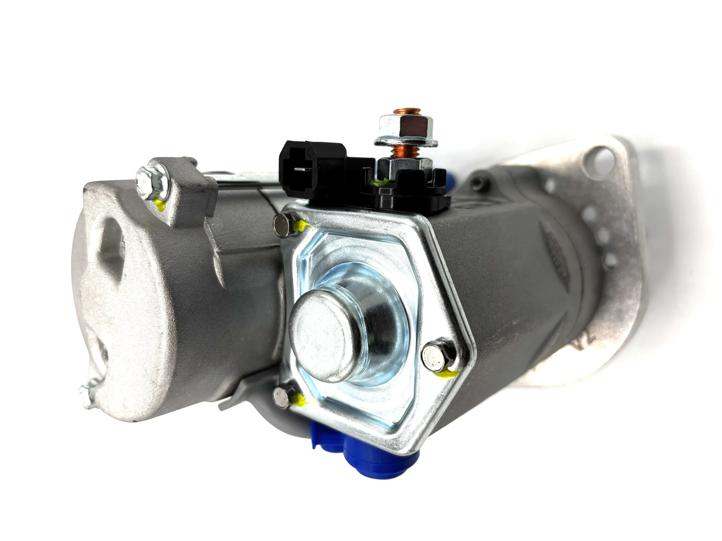 WOSP High Torque Gear Reduction VW Starter. Gray in color. Has small gear on the front. Has wire post on the side and a single pin plug. Has motor on top. Has Blue wire post boot.