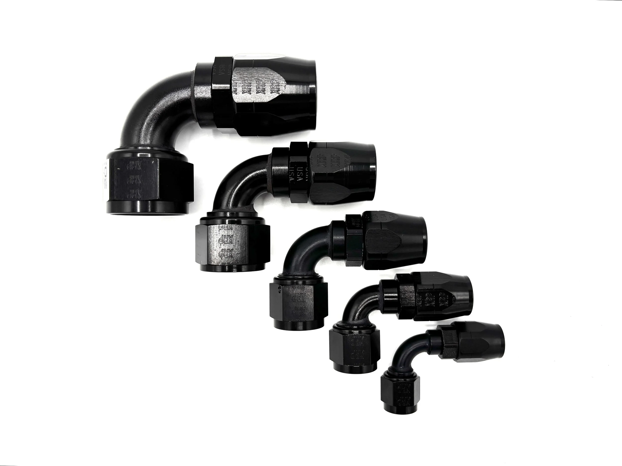 Five 90 Deg. Swivel Hose End to AN Female fittings black. The bends are going towards the right. They are arranged in a line from largest to smallest.