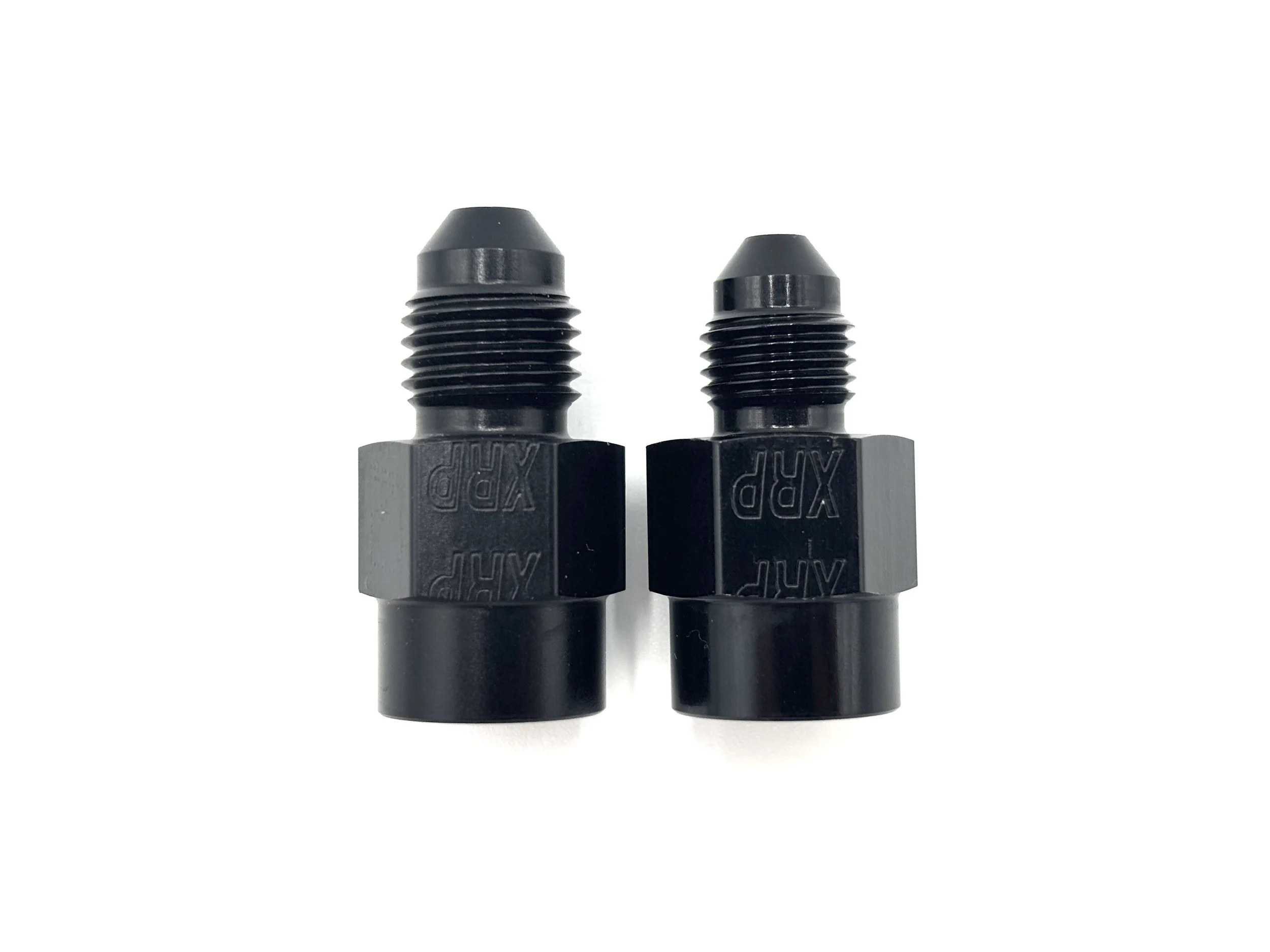 XRP straight AN male to 1/8NPT female gauge adapter. Black in color. Various sizes from largest to smallest, left to right.