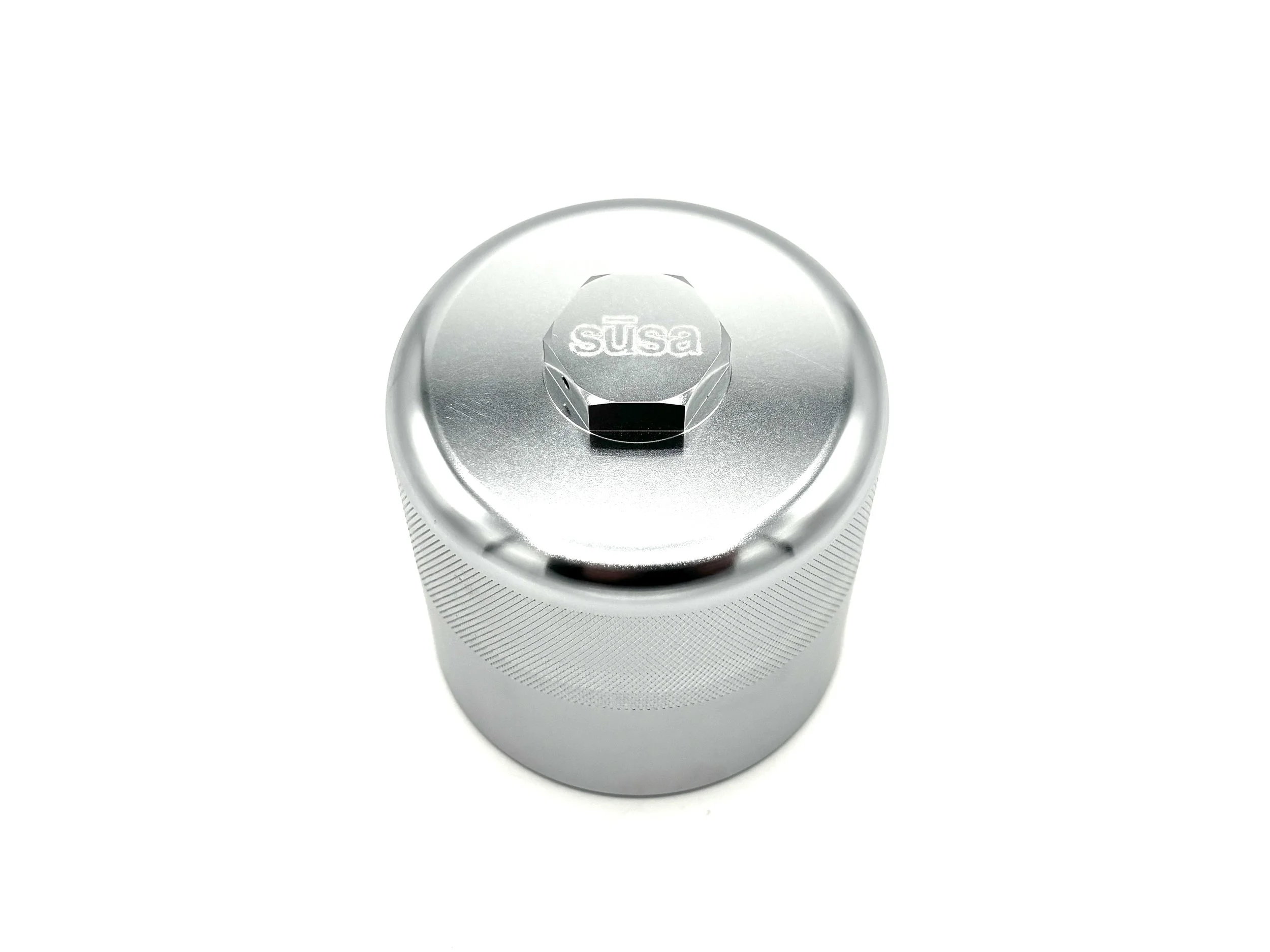 Bottom View of Silver Oil Filter. SUSA is written on the Hex at the bottom of the filter.