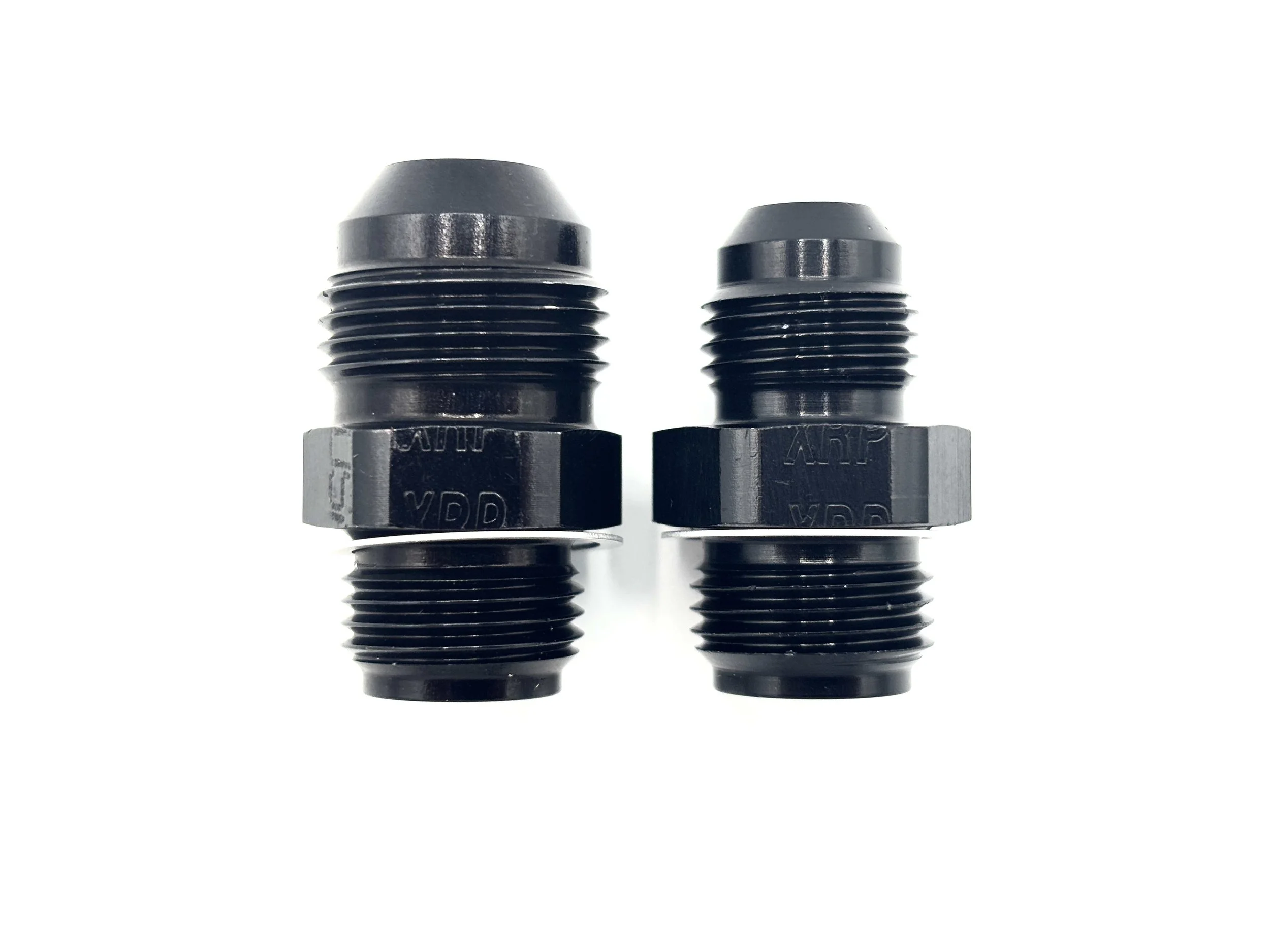 XRP straight AN male to 5/8-18 inverted flare fuel pump adapter. Black in color. Various sizes from largest to smallest, left to right.