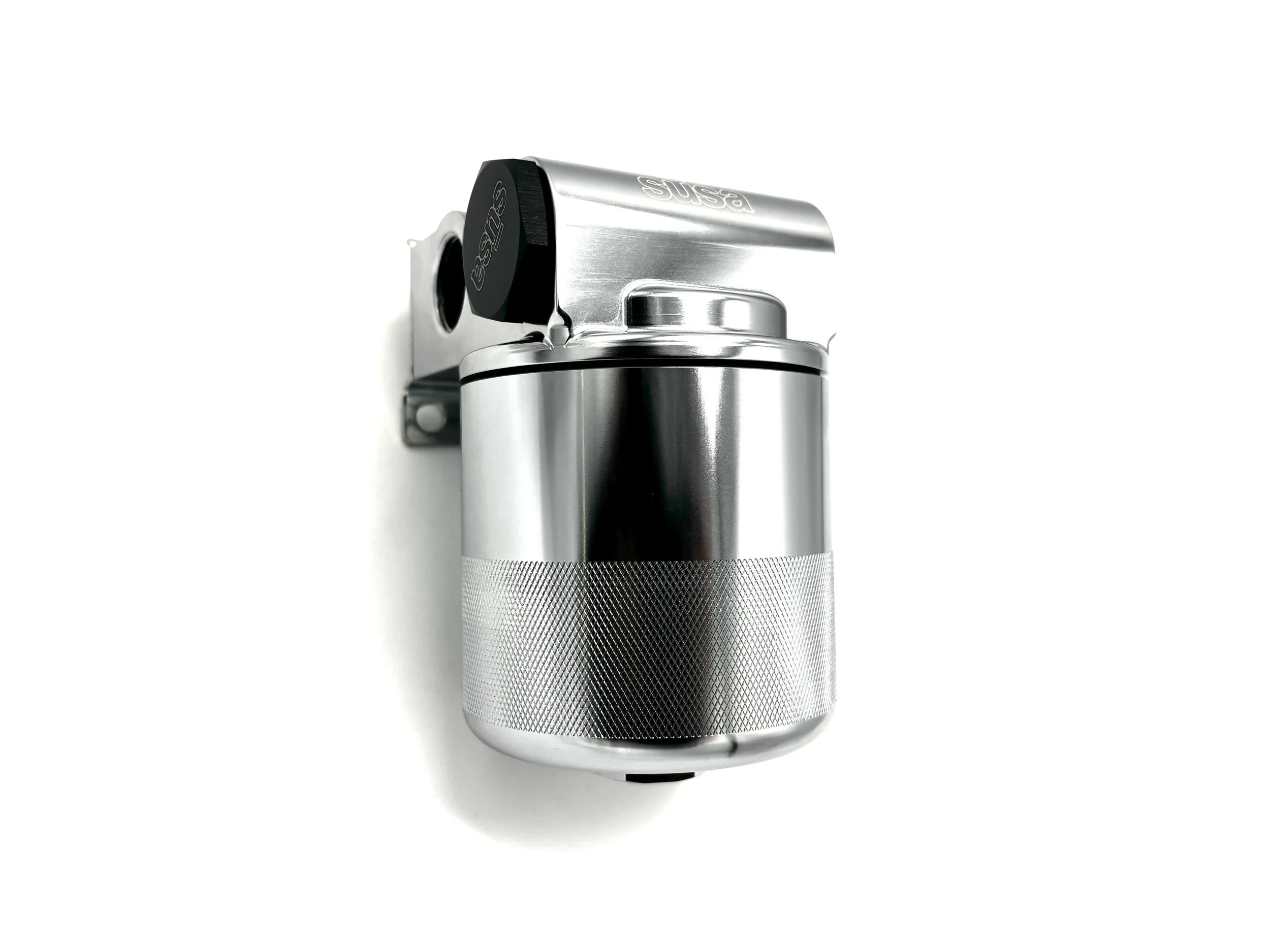 Setrab Remote Oil Filter Stand 77mm. Rectangular oil filter head, has 2 plugs in it with 4 ports. Side View of filter head with silver filter inserted. Silver