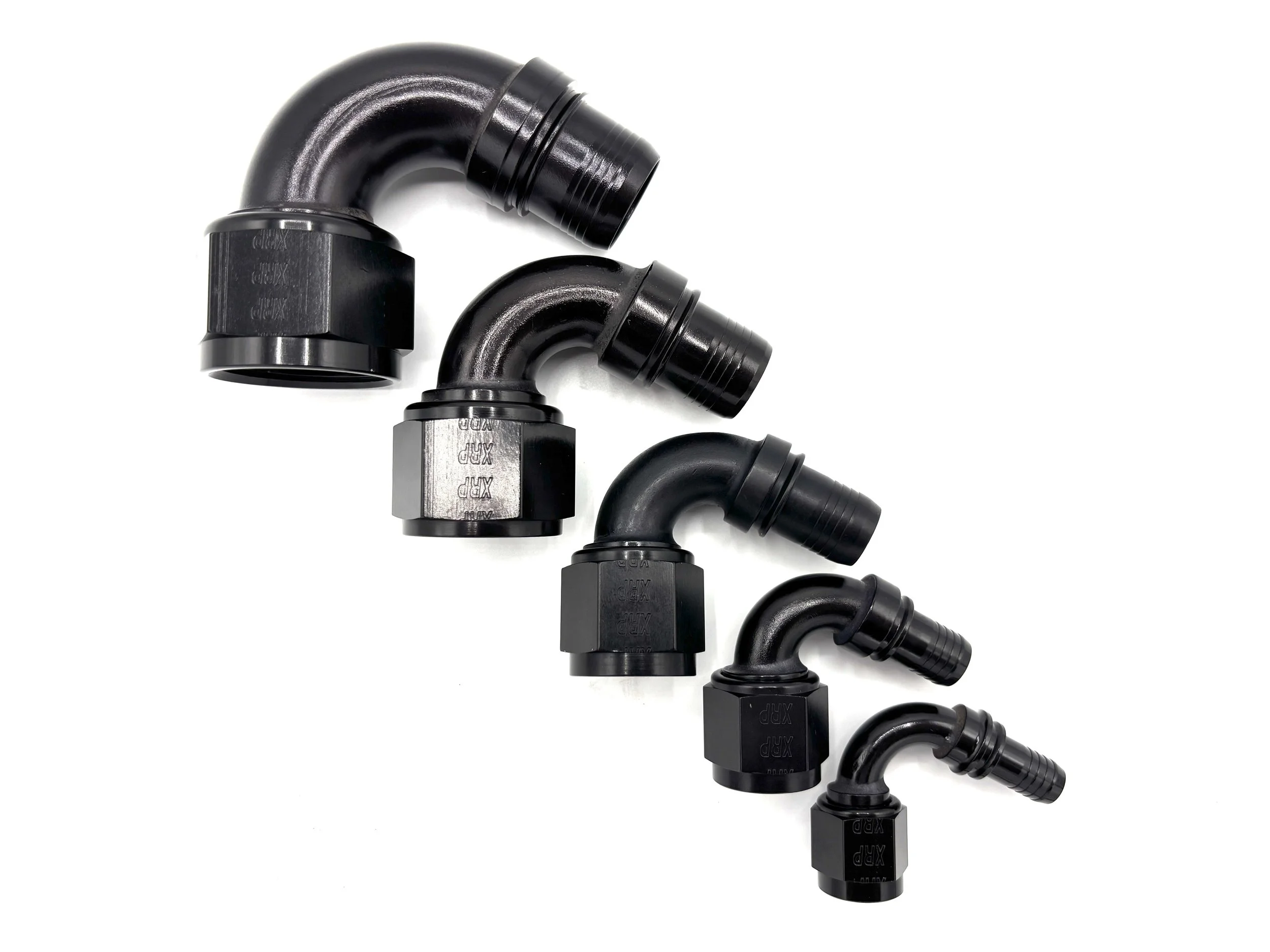 XRP 120 deg. race crimp hose end to AN female. Black in color. Various sizes from largest to smallest, left to right.