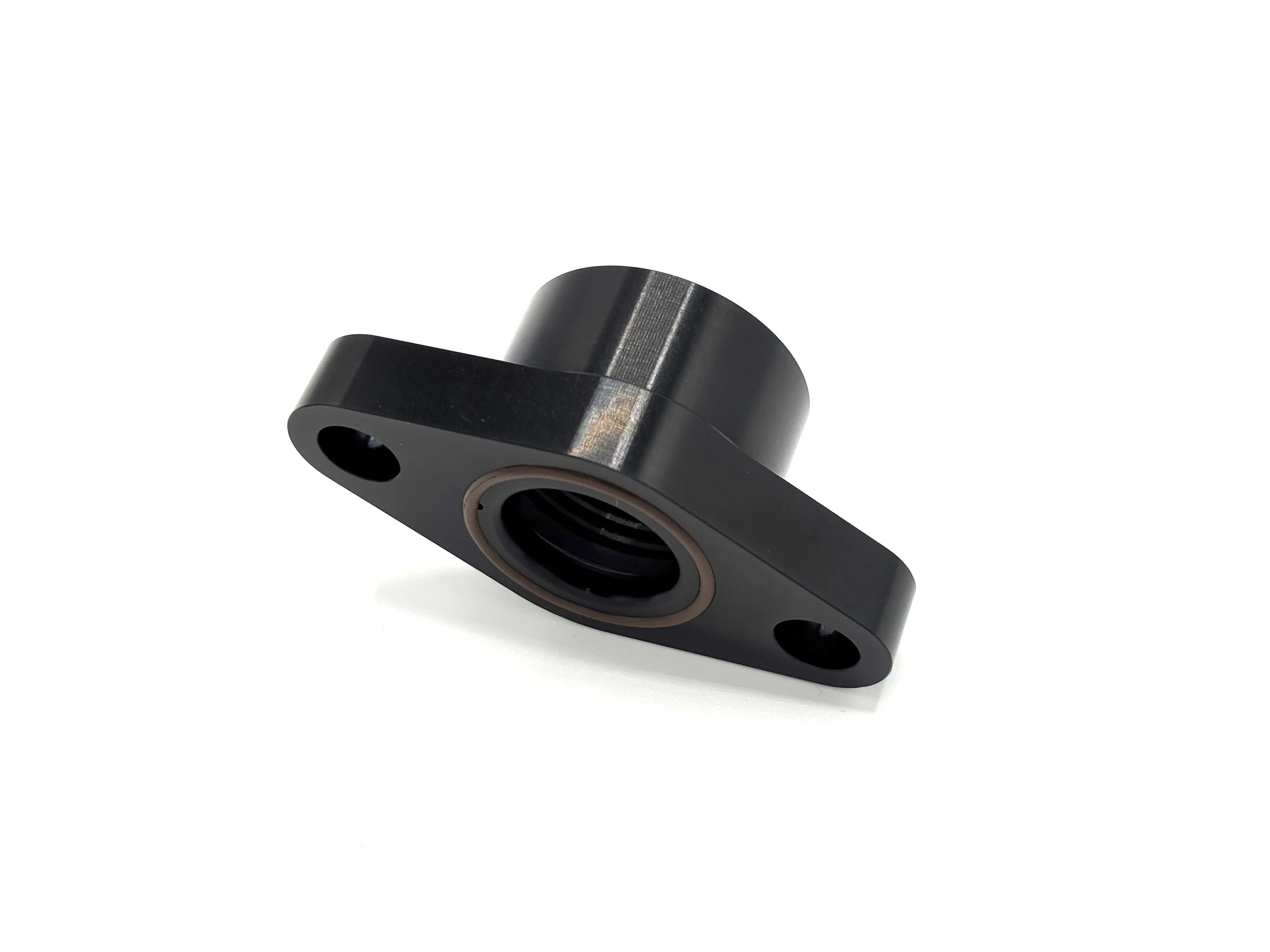 Earl's -12AN ORB female to turbo oil drain flange fitting. Black in color.