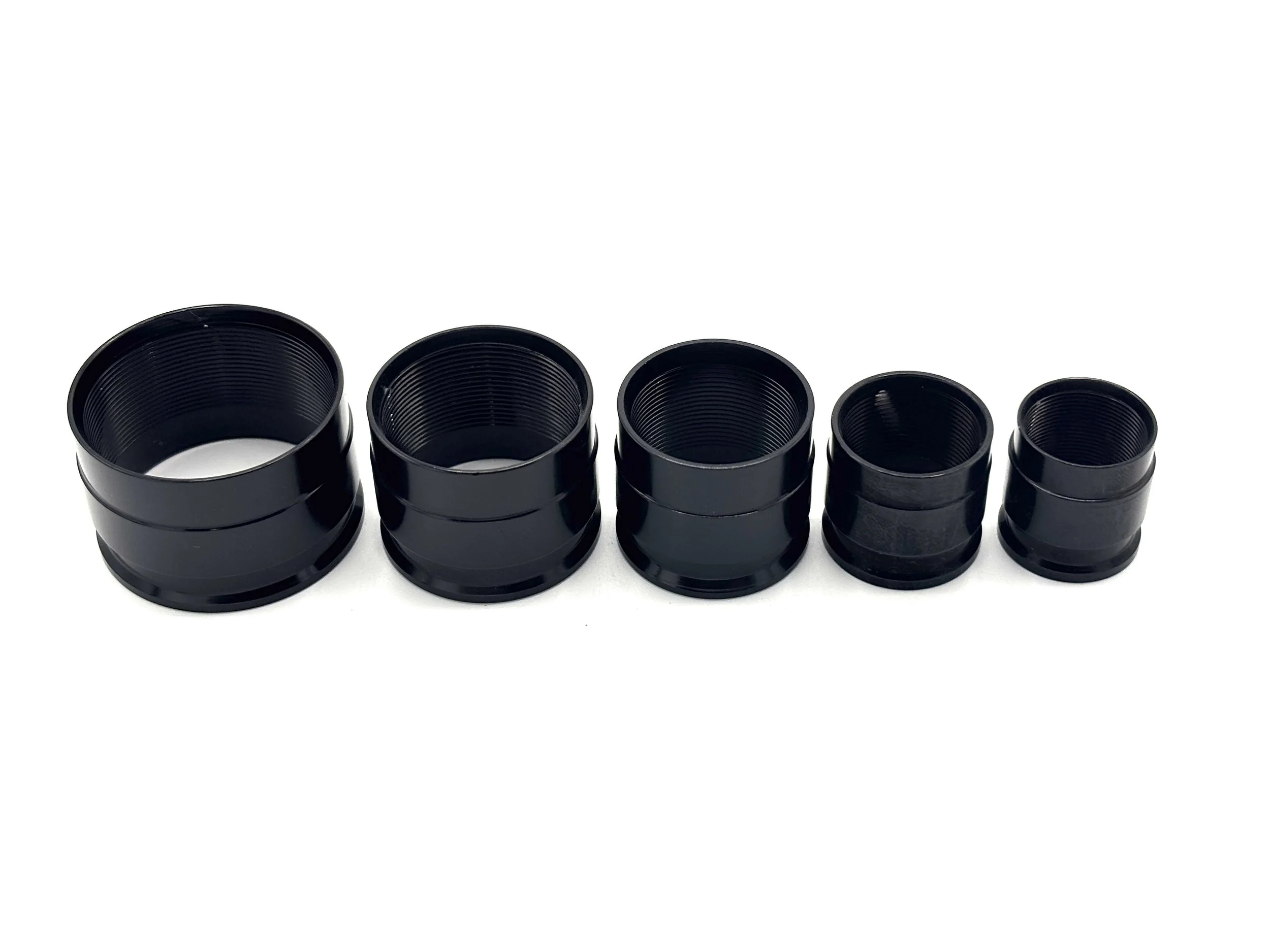 XRP ProPlus PTFE crimp collar. Black in color. Various sizes from largest to smallest, left to right.