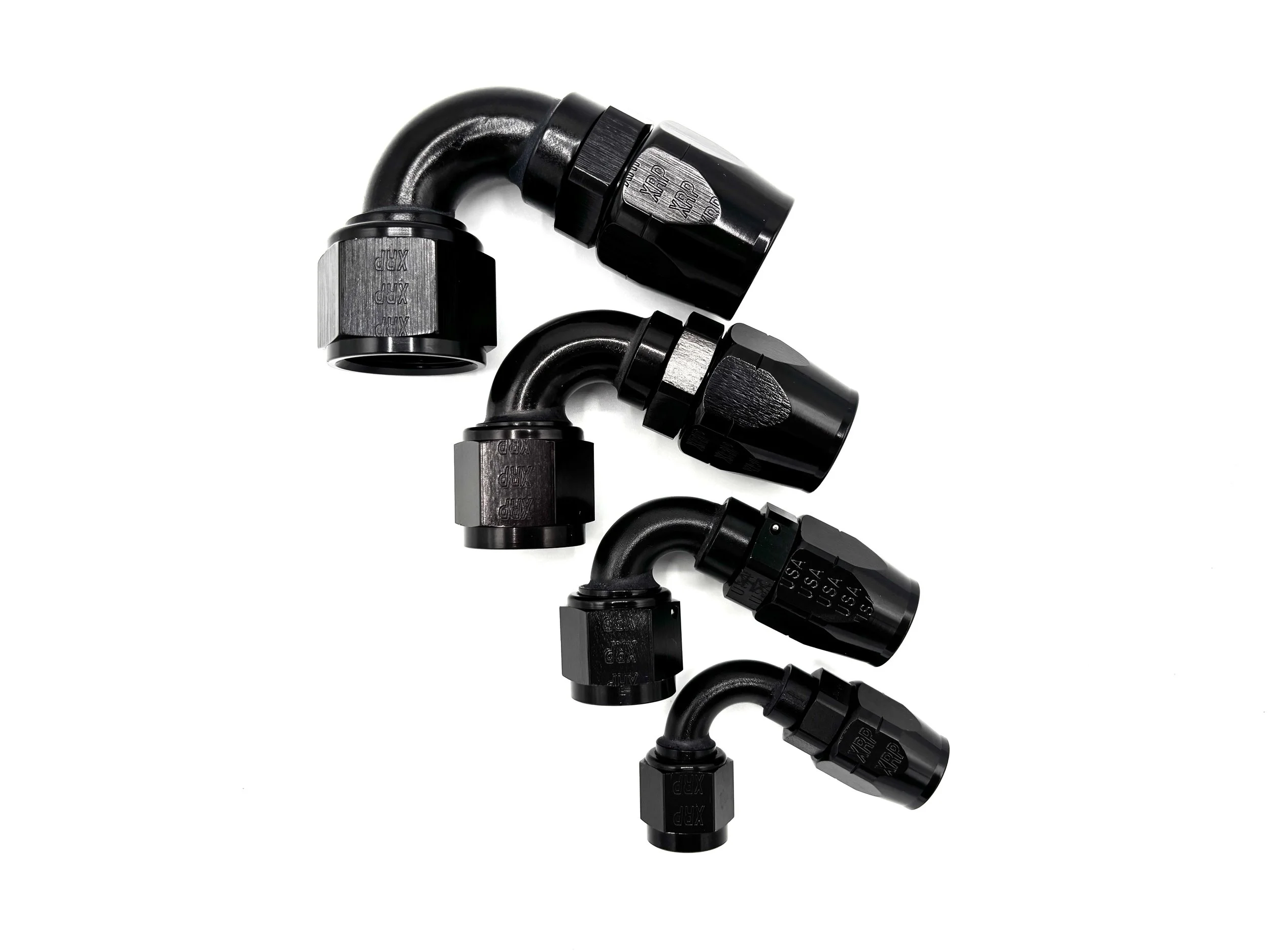 Four 120 Deg. Swivel Hose End to AN Female fittings black. The bend is facing towards the right. The hose end is on top.
