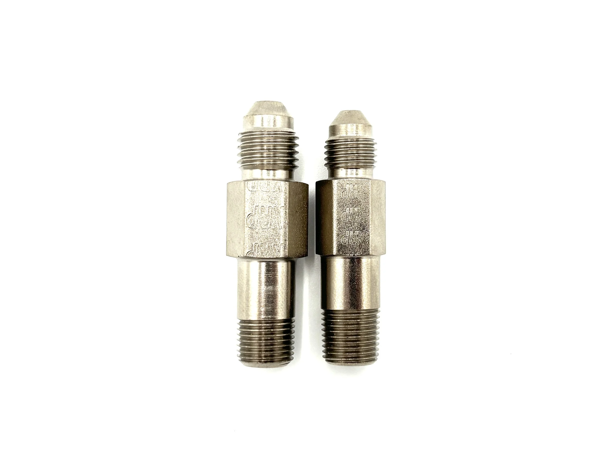 XRP AN male to 1/8NPT male steel extended adapter. Silver in color. Various sizes from largest to smallest, left to right.