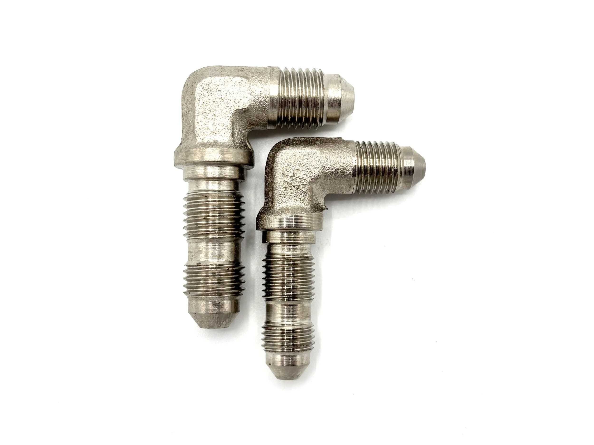 XRP 90 deg. AN male to AN male steel bulkhead adapter. Silver in color. Various sizes from largest to smallest, left to right.