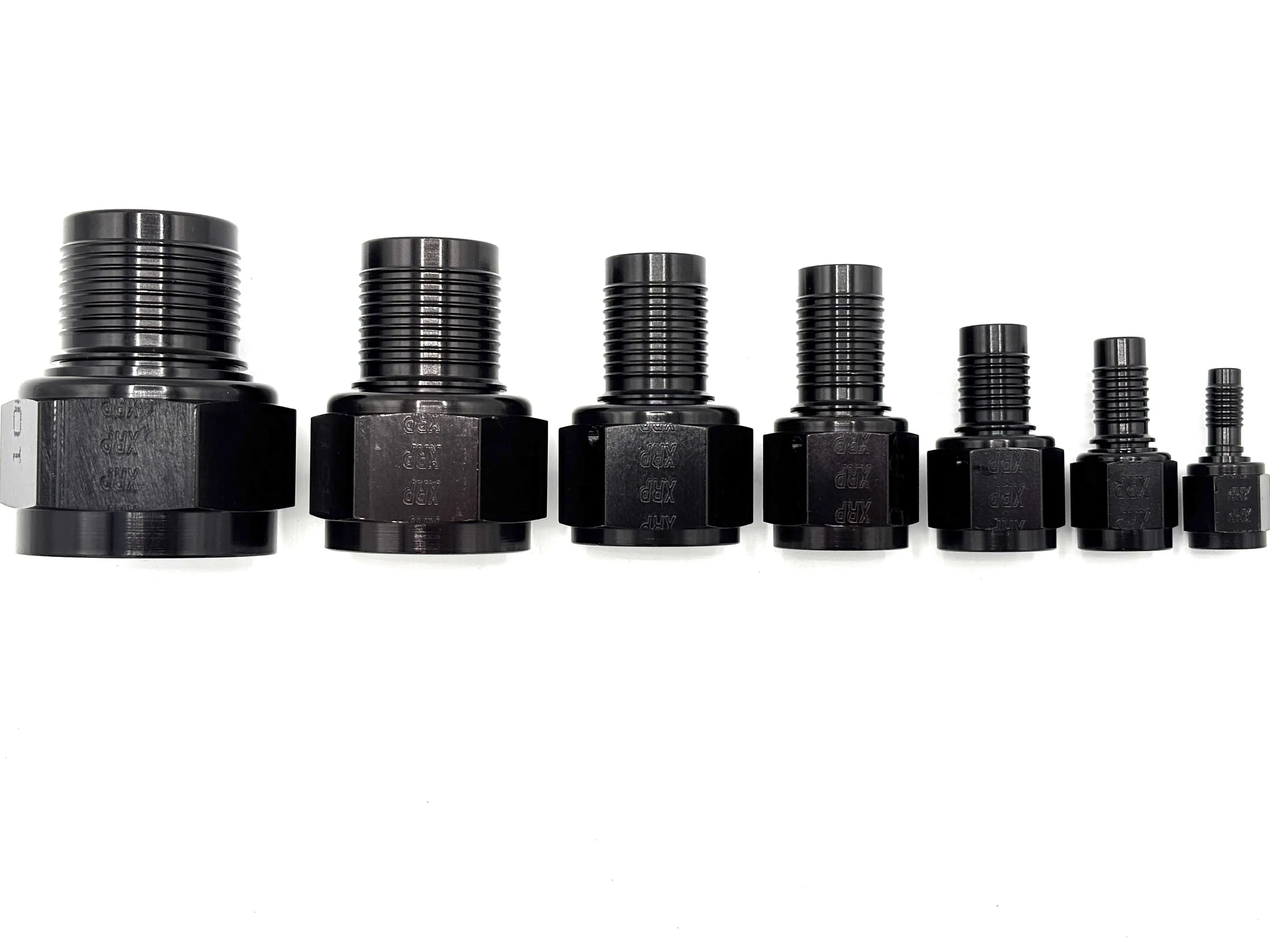 XRP straight HS-79 hose end to AN female. Black in color. Various sizes from largest to smallest, left to right.