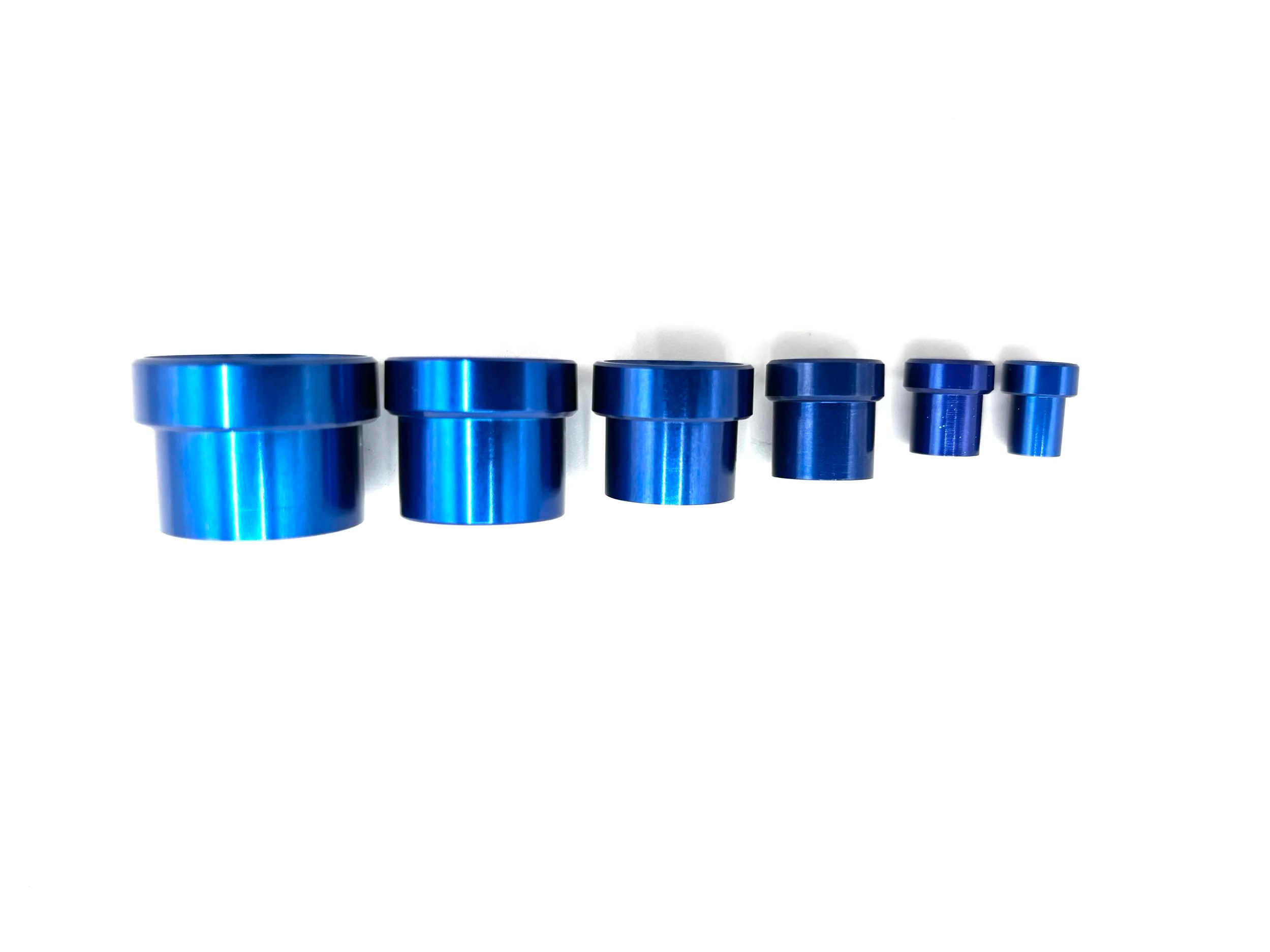 XRP blue aluminum tube sleeves. Various sizes from largest to smallest, left to right.