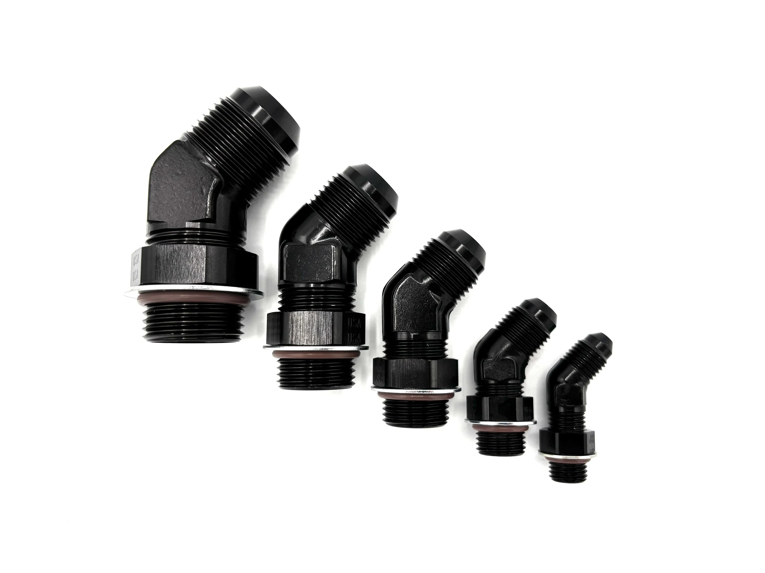 XRP 45 deg. AN male to ORB adapter fitting. Black in color. Has nut, washer, and o-ring on it. Various sizes from largest to smallest, left to right.