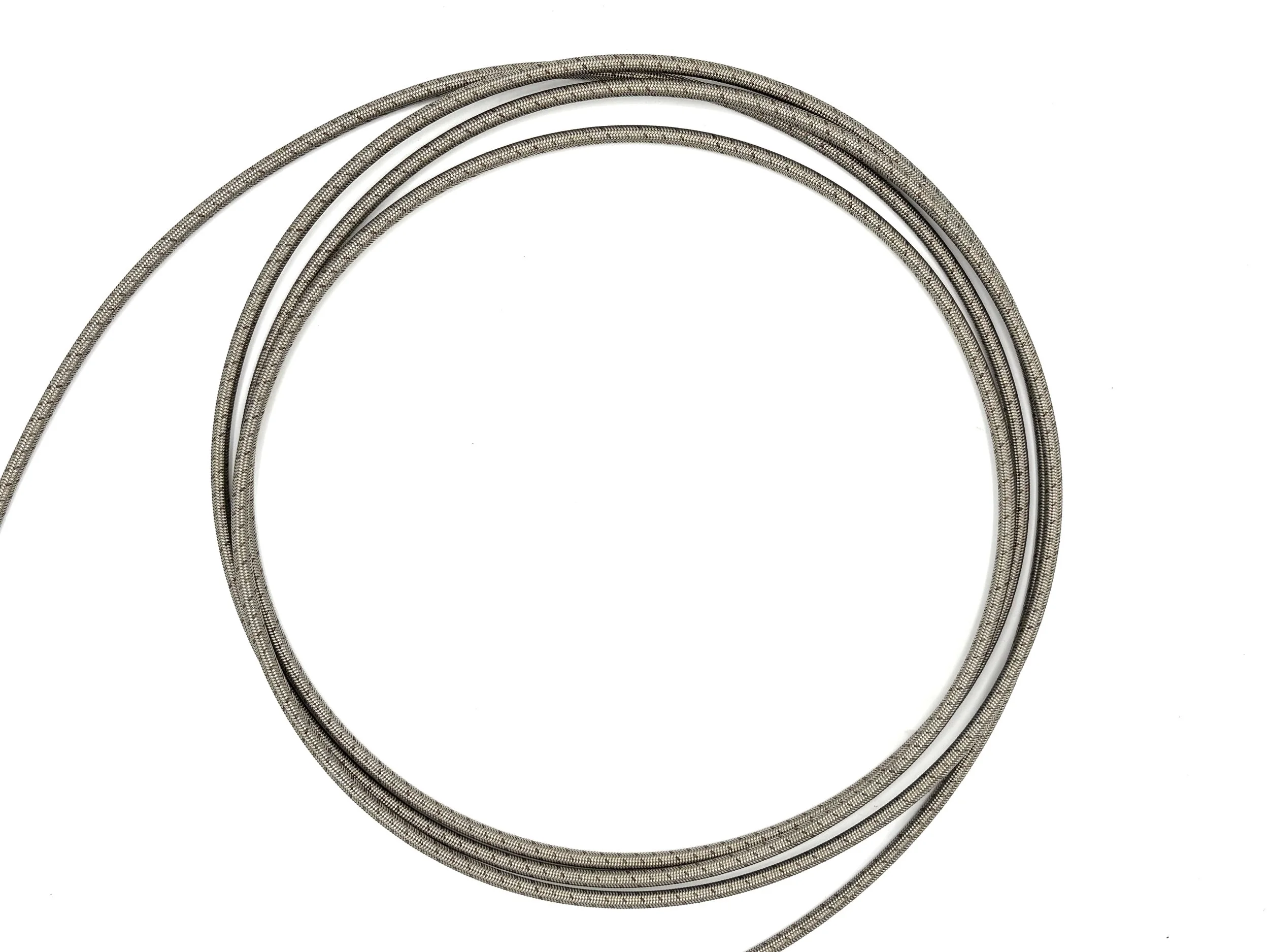 XRP stainless steel braided PTFE hose. Top view of hose. Silver in color.