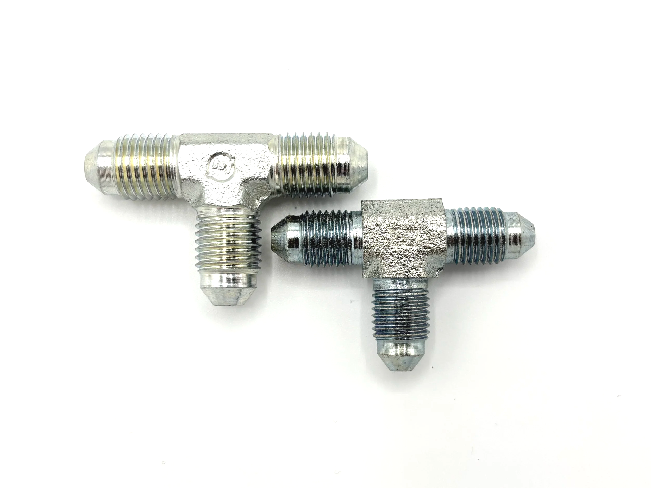 XRP AN male to AN male steel tee adapter. Silver in color. Various sizes from largest to smallest, left to right.