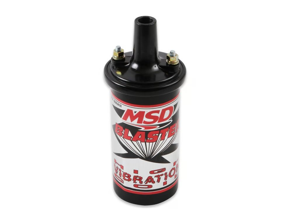MSD ignition coil, part of the blaster series. Black in color. Has gold color nuts on silver color posts. Has red and chrome lettering.