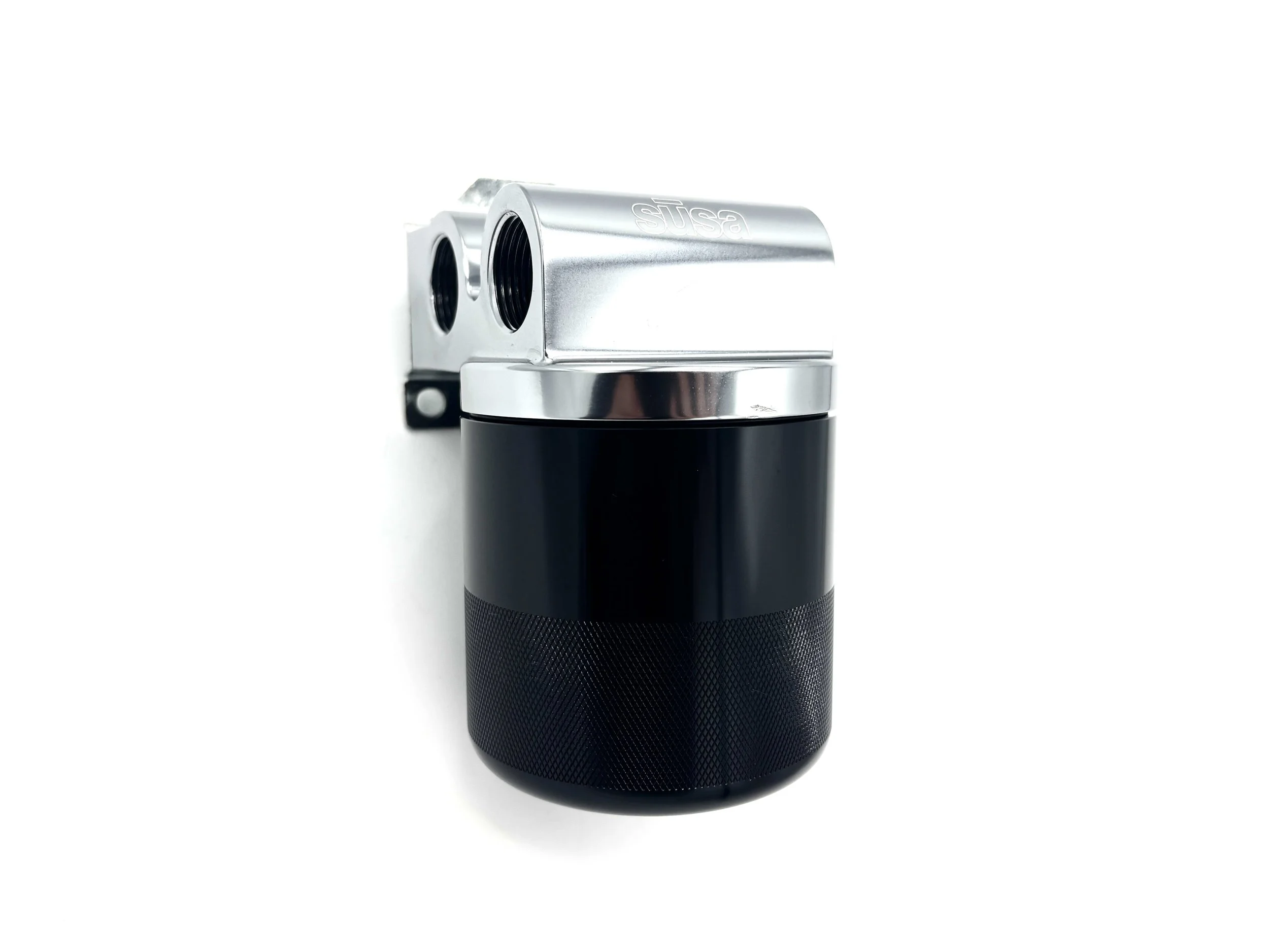 Setrab Thermostatic Remote Oil Filter Stand 77mm. Rectangular oil filter head, has 4 ports with a thermostat inserted to the back of the unit. Front Side View, black filter is inserted to unit