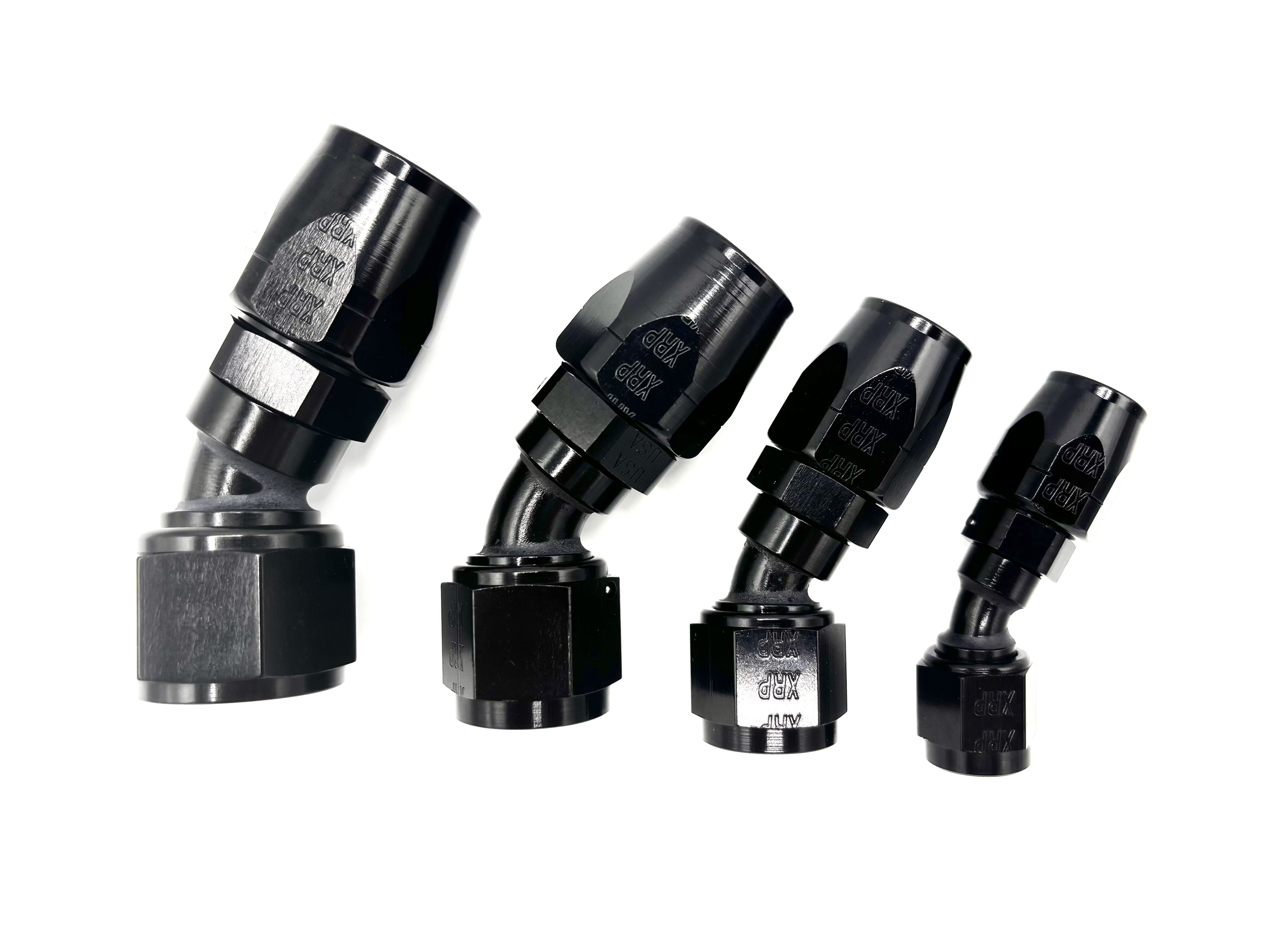 Four 30 Deg. Swivel Hose End to AN Female fittings black. The bends are going towards the right. They are arranged in a line from largest to smallest.