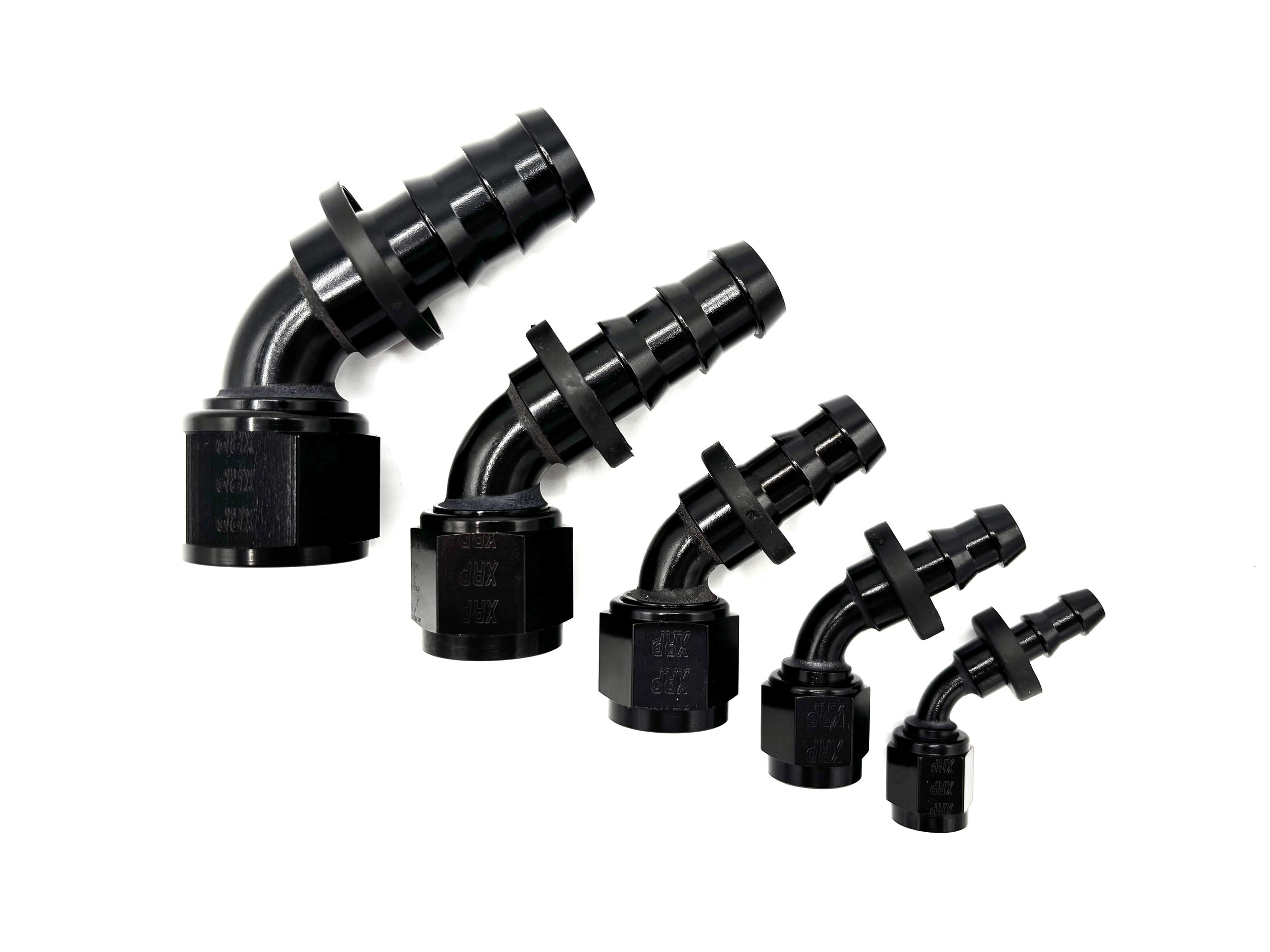 Five 60 Deg. Push Lock Hose End to AN Female fittings black. The bends are going towards the right. They are arranged in a line from largest to smallest.