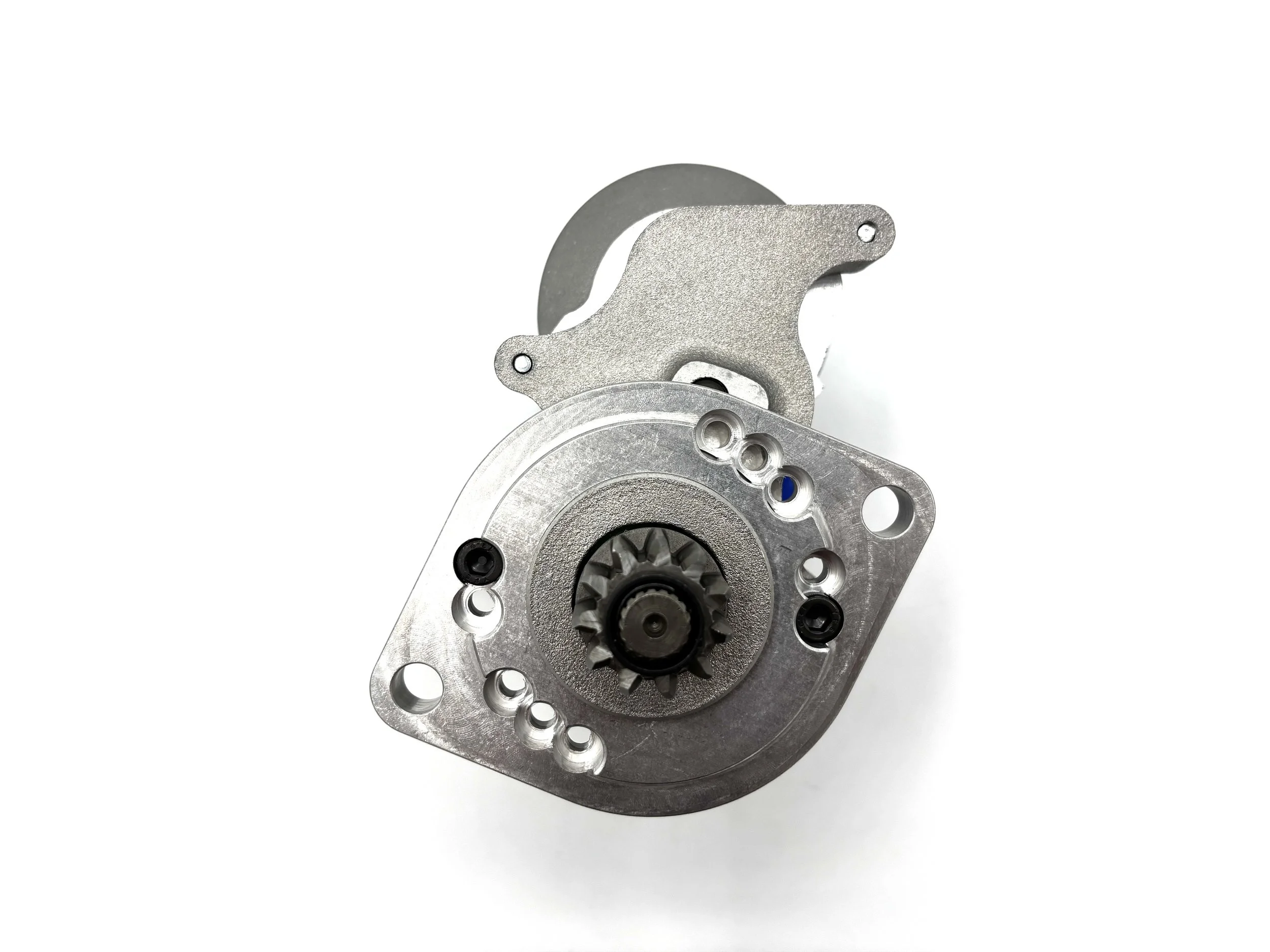 WOSP High Torque Gear Reduction VW Starter. Gray in color. Has small gear on the front. Has wire post on the side and a single pin plug. Has motor on top.