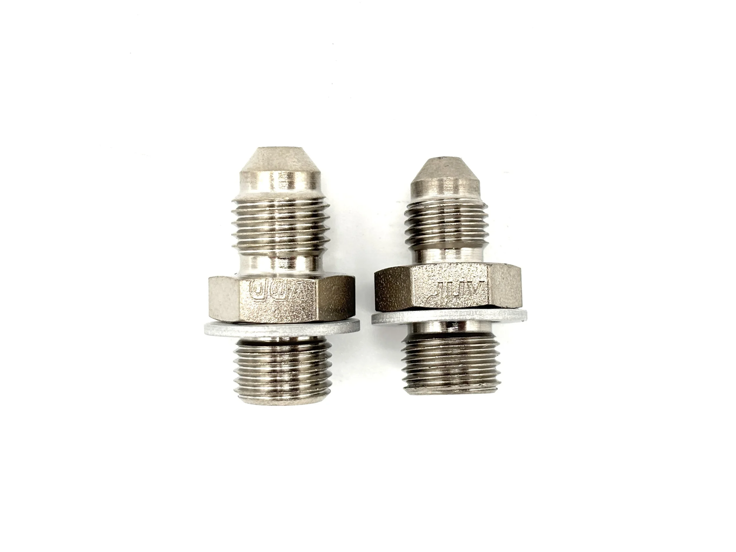 XRP AN male to 7/16-24 male steel crush washer seal adapter. Silver in color. Various sizes from largest to smallest, left to right.