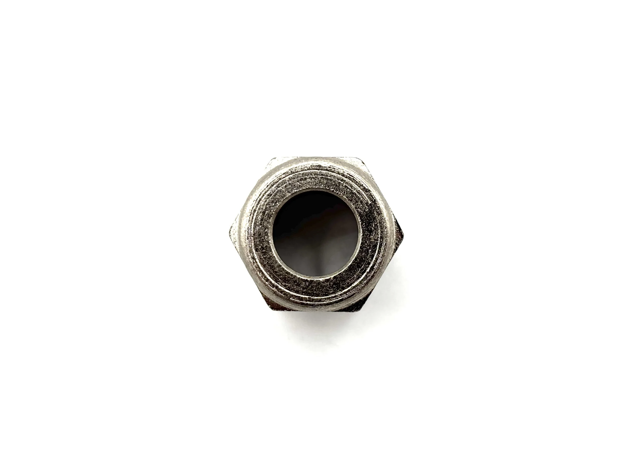 XRP nickel plated steel AN female tube nut. Top view with hole in the middle.
