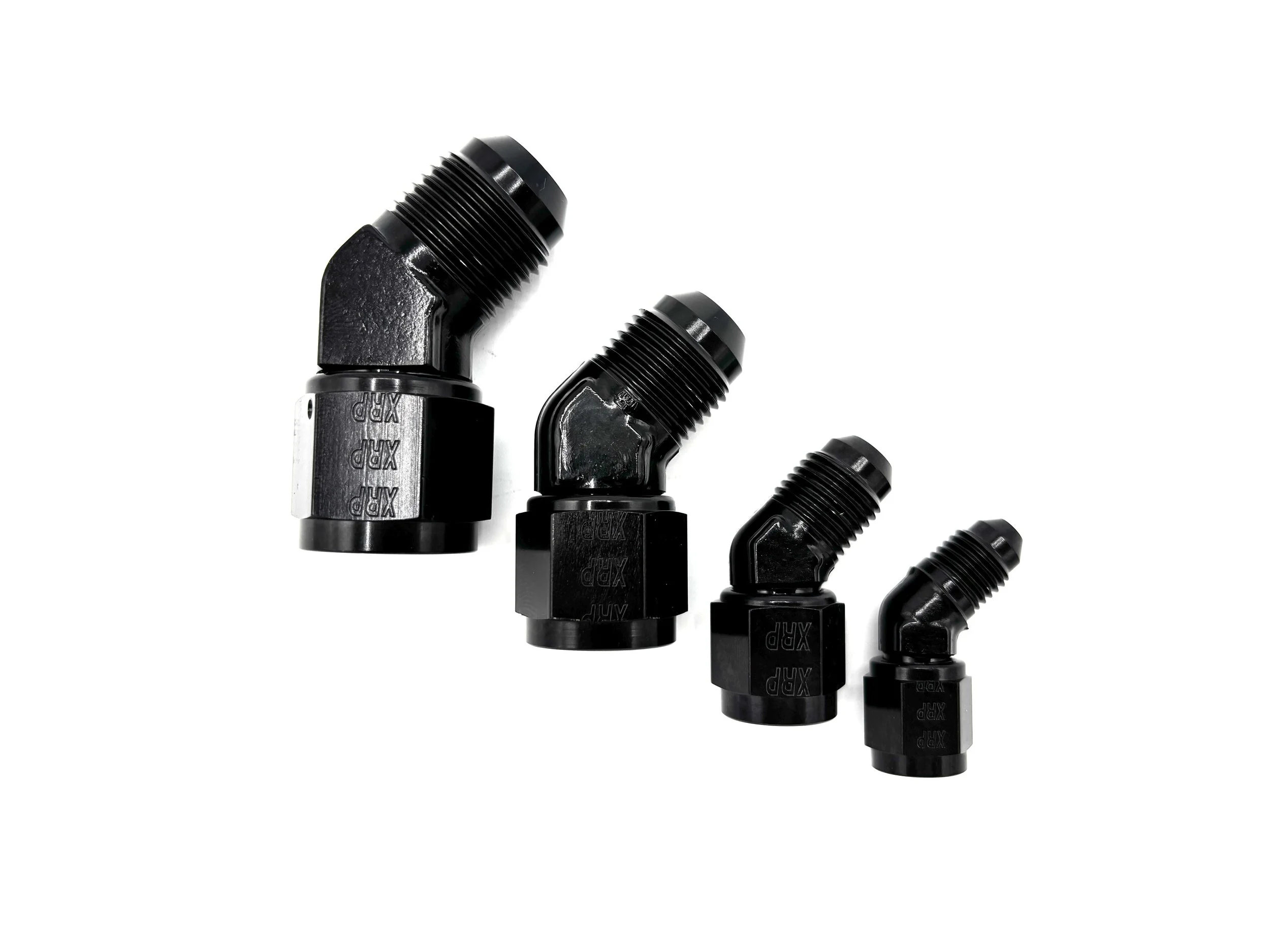 Four 45 Deg. Forged AN Female Swivel To AN Male Adapter fittings black. The bends are going towards the right. They are arranged in a line from largest to smallest.