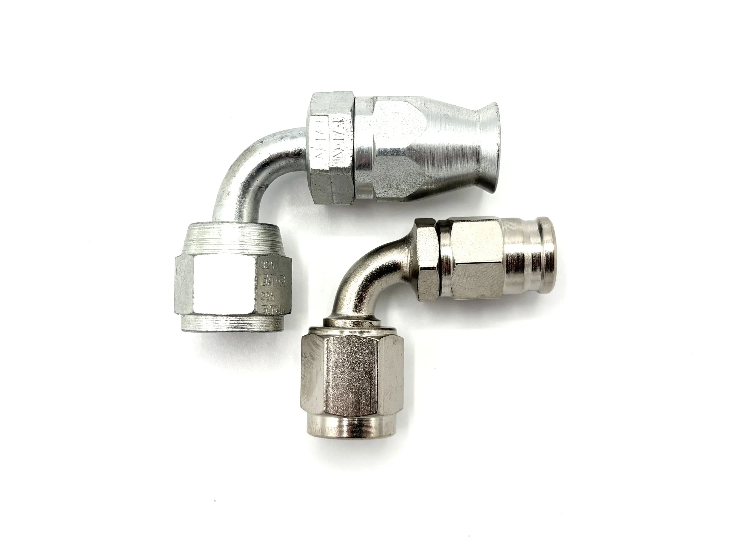 XRP 90 deg. AN PTFE steel hose end to AN female. Silver in color. Various sizes from largest to smallest, left to right.