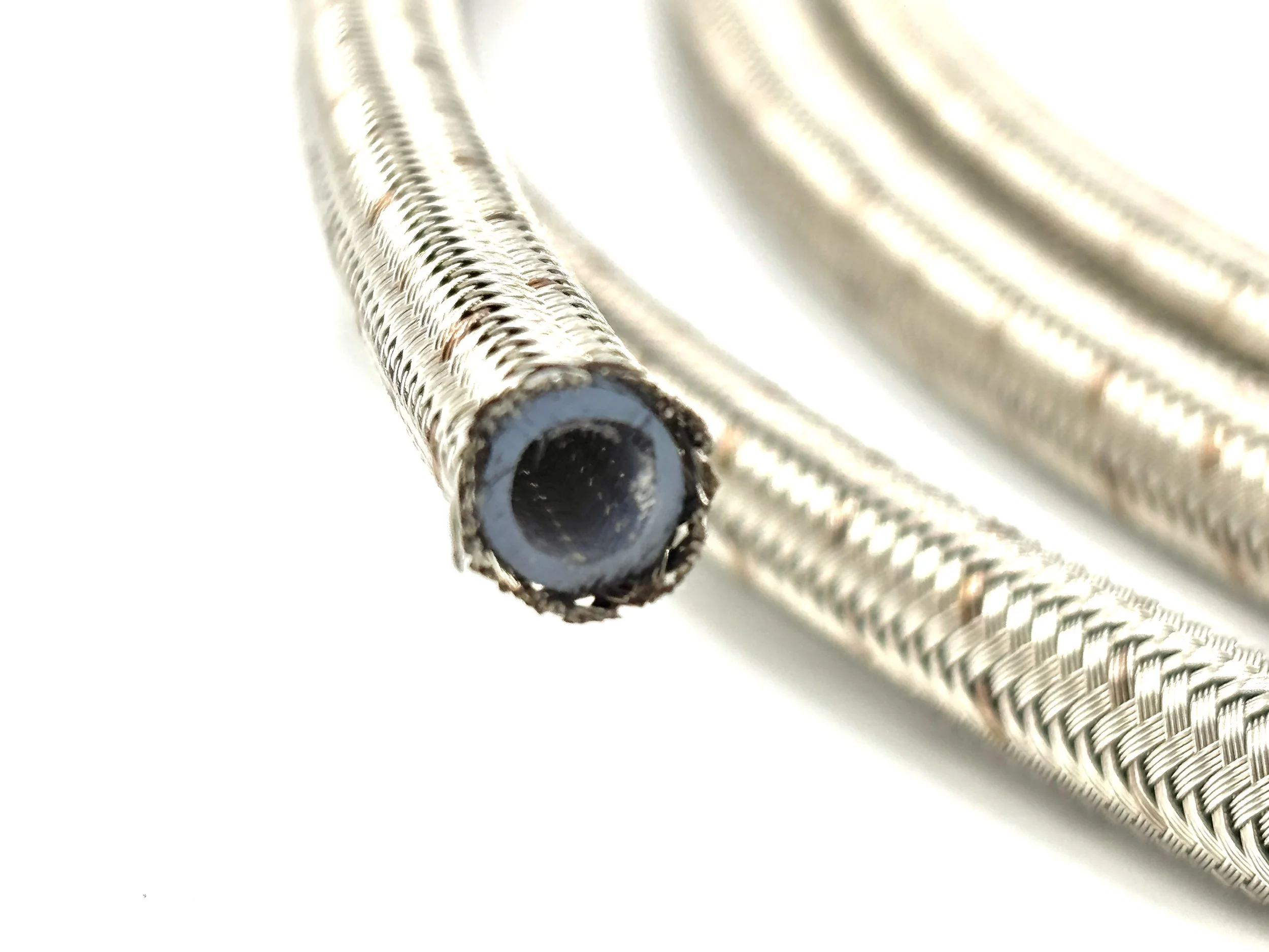 XRP stainless steel braided PTFE hose.