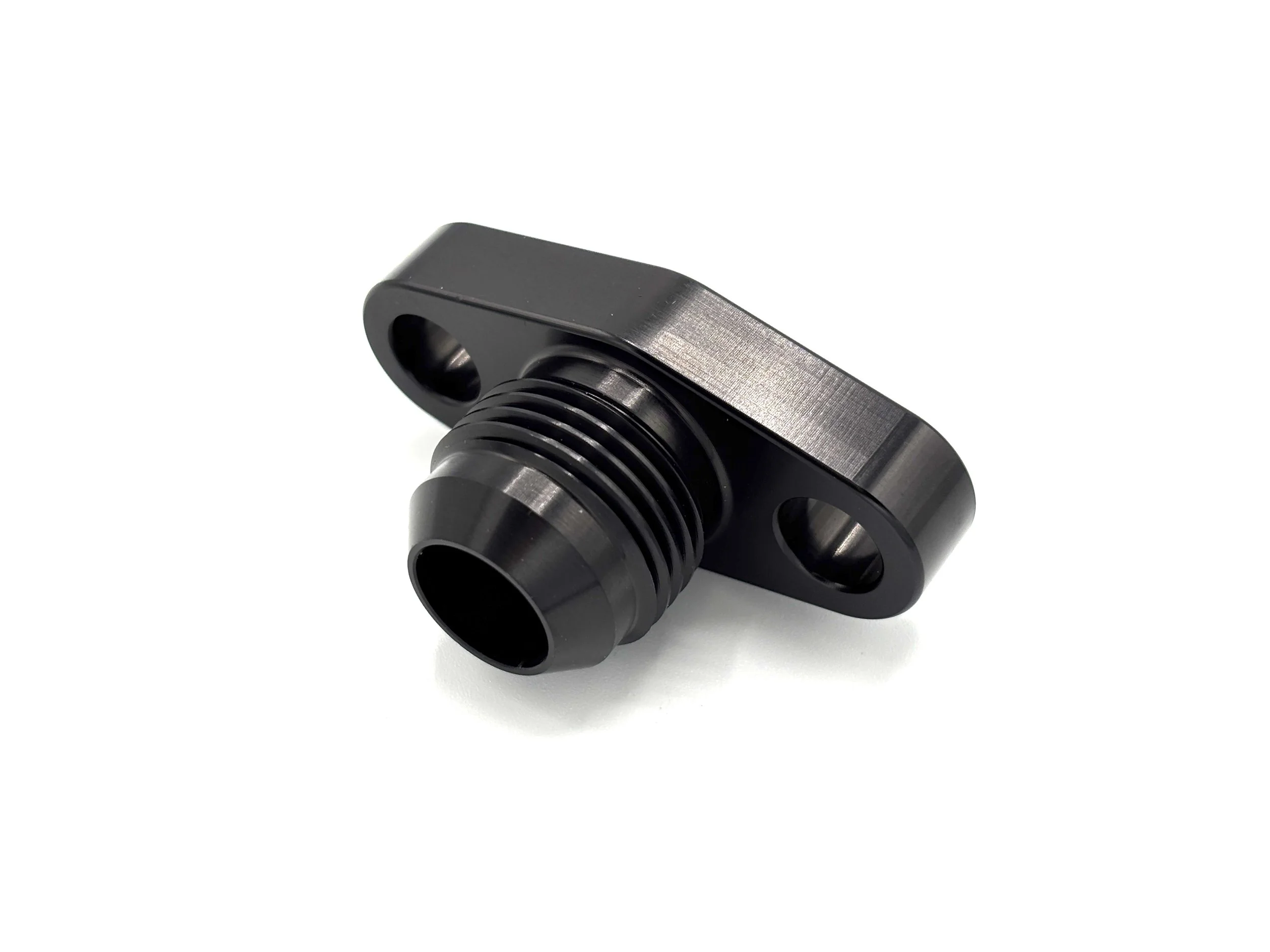 Earl's -10AN male to turbo oil drain flange fitting. Black in color.