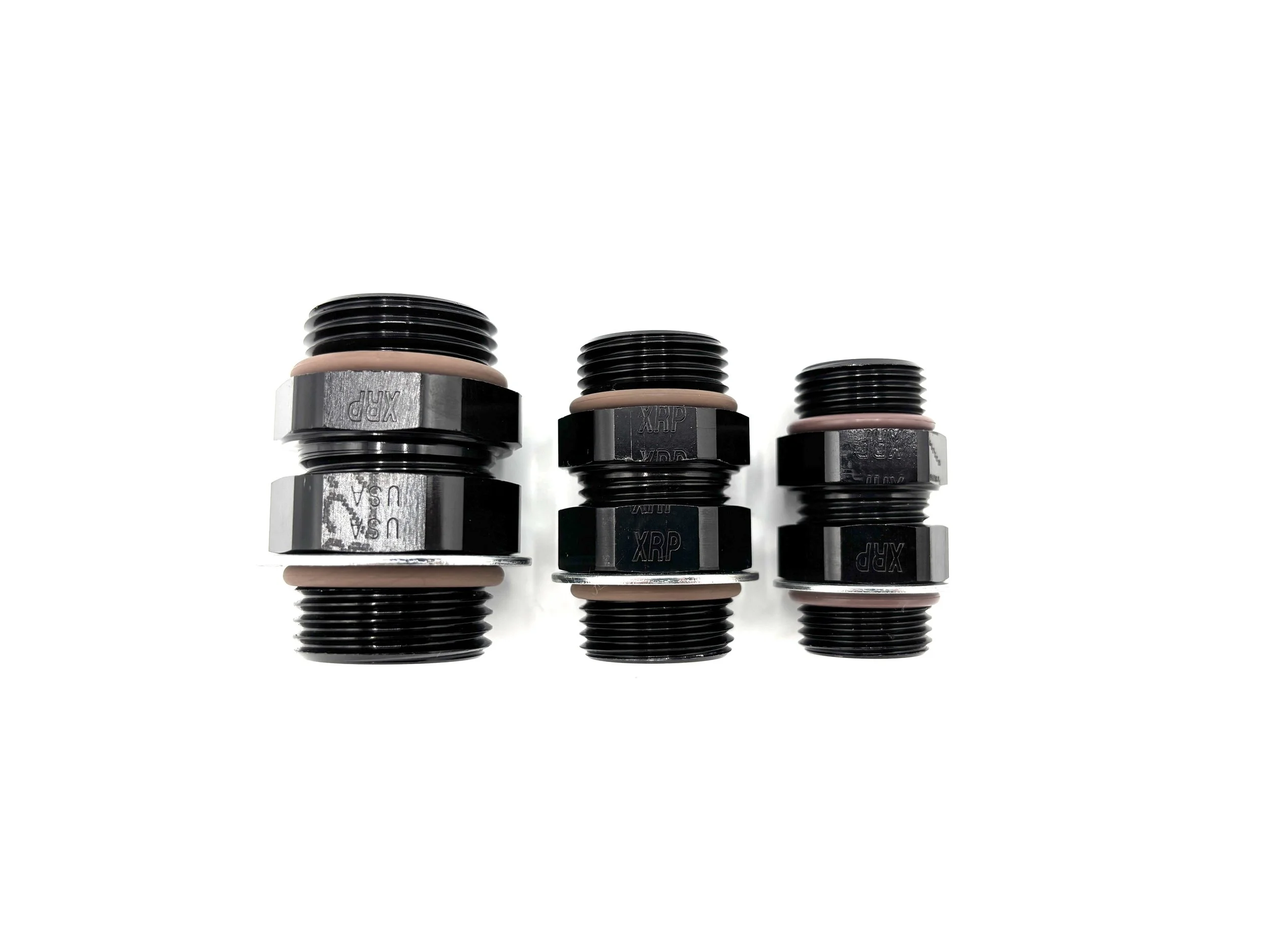 XRP straight male to male o-ring boss coupler fitting. Has nut, washer, and o-ring. Black in color. Various sizes from largest to smallest, left to right.