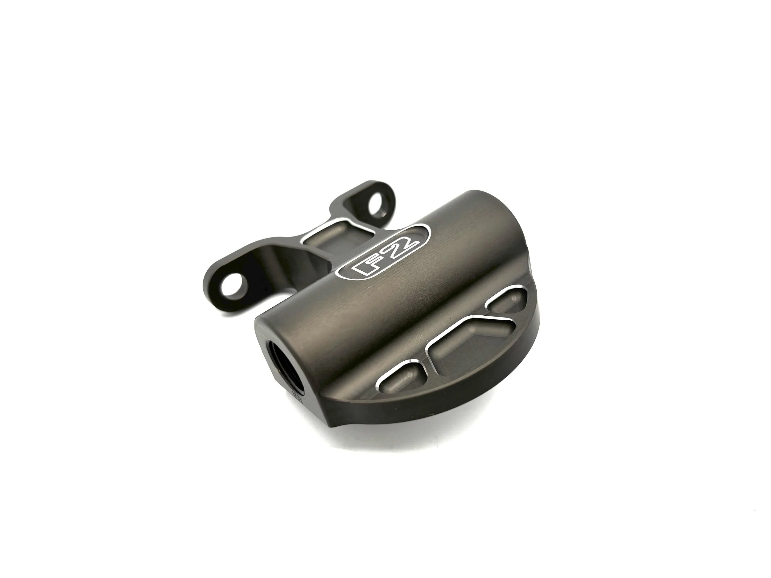 F2 Oil filter head. Top view side angle. Finished in grey anodizing. Has F2 logo engraved in the top.