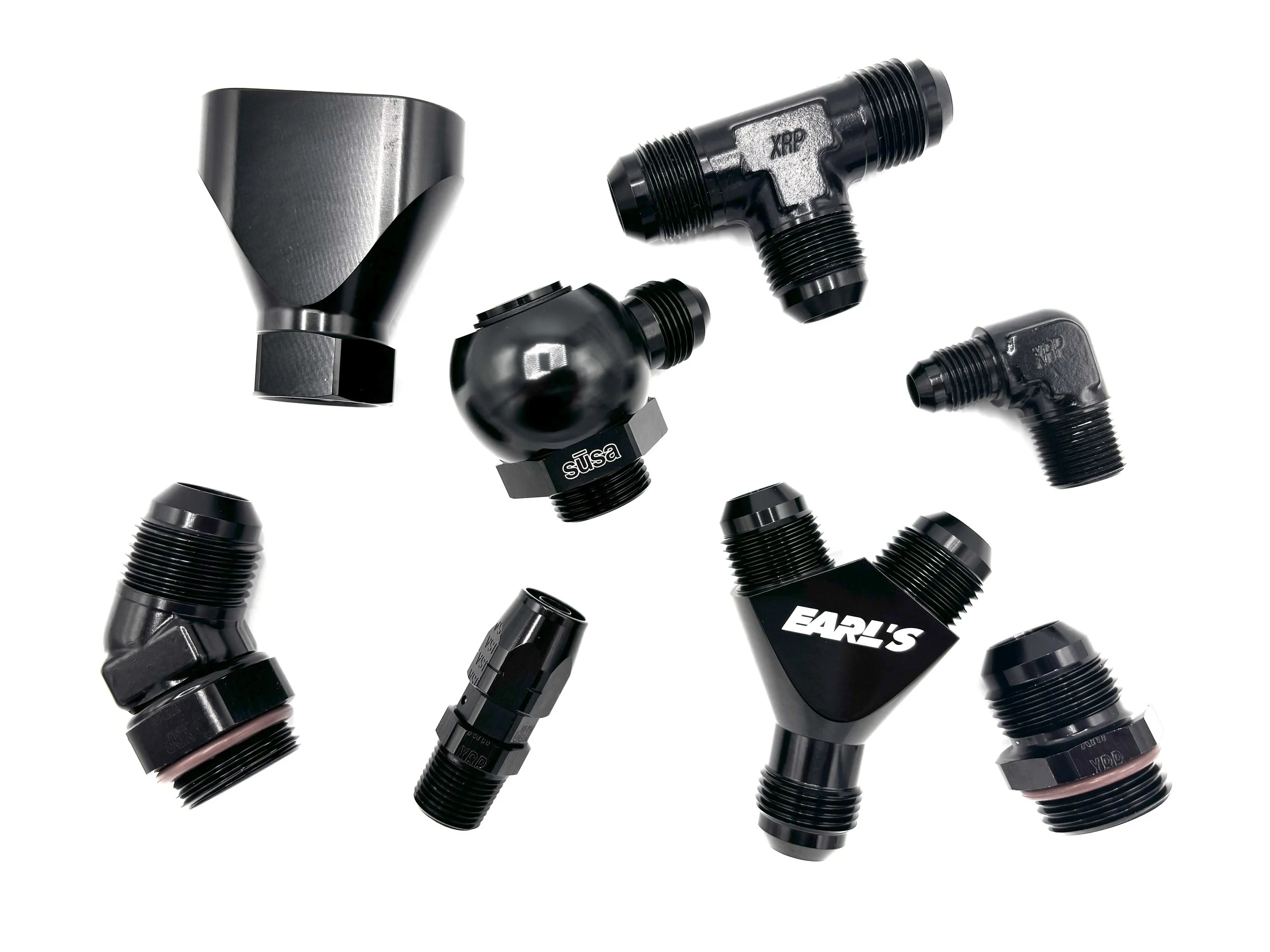 Miscellaneous AN adapters all spread out on a white background.