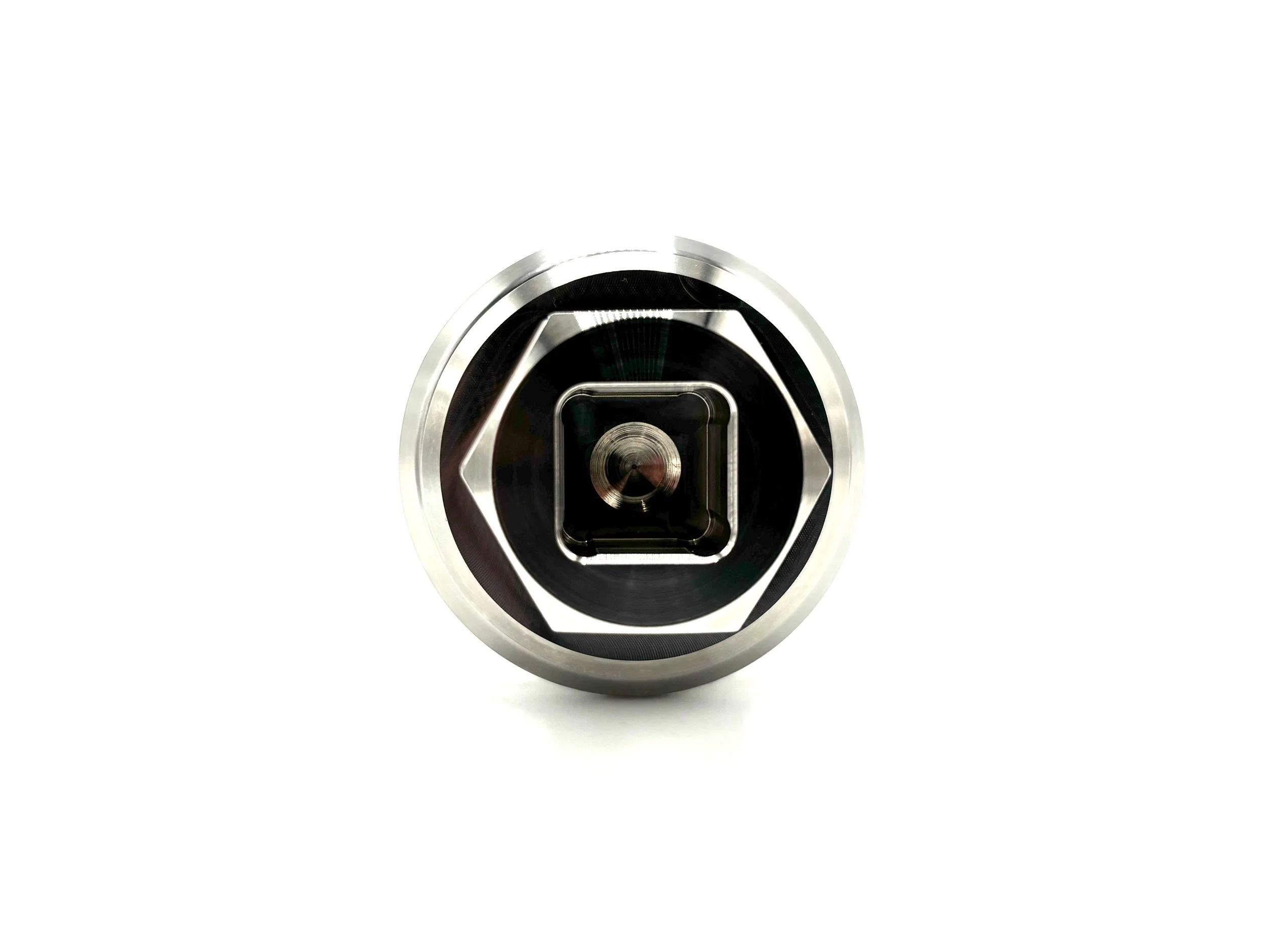 Stainless Steel Bolt. Silver color. Bolt has a square bore in the middle. Front view of the square bore.