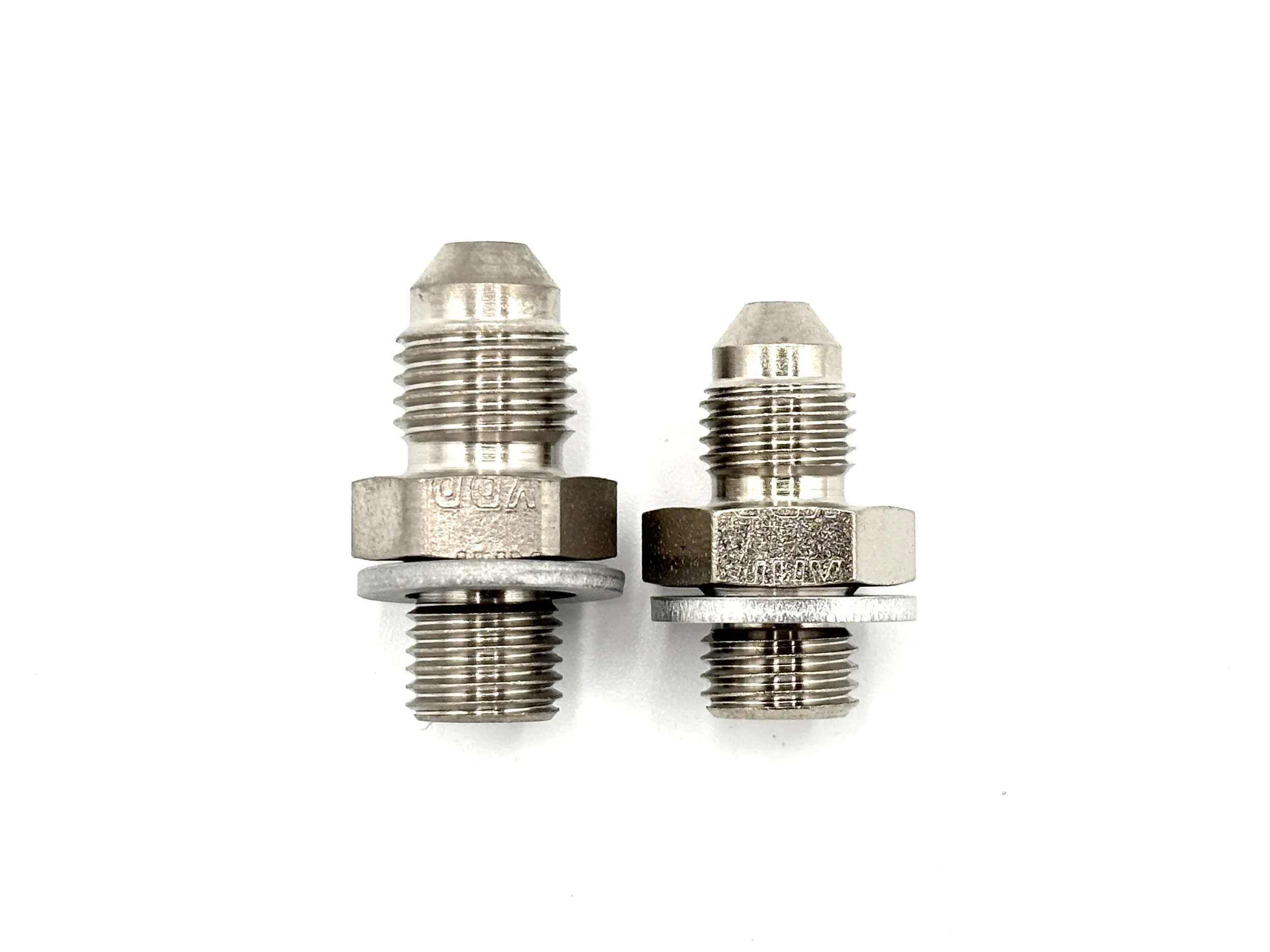 XRP AN male to 3/8-24 male steel crush washer seal adapter. Silver in color. Various sizes from largest to smallest, left to right.