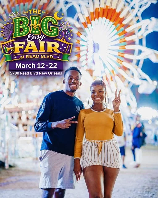 A man and woman smiling at a fair with a large Ferris wheel in the background, promoting 'The Big Easy Fair' at Read Blvd. in New Orleans from March 12-22.