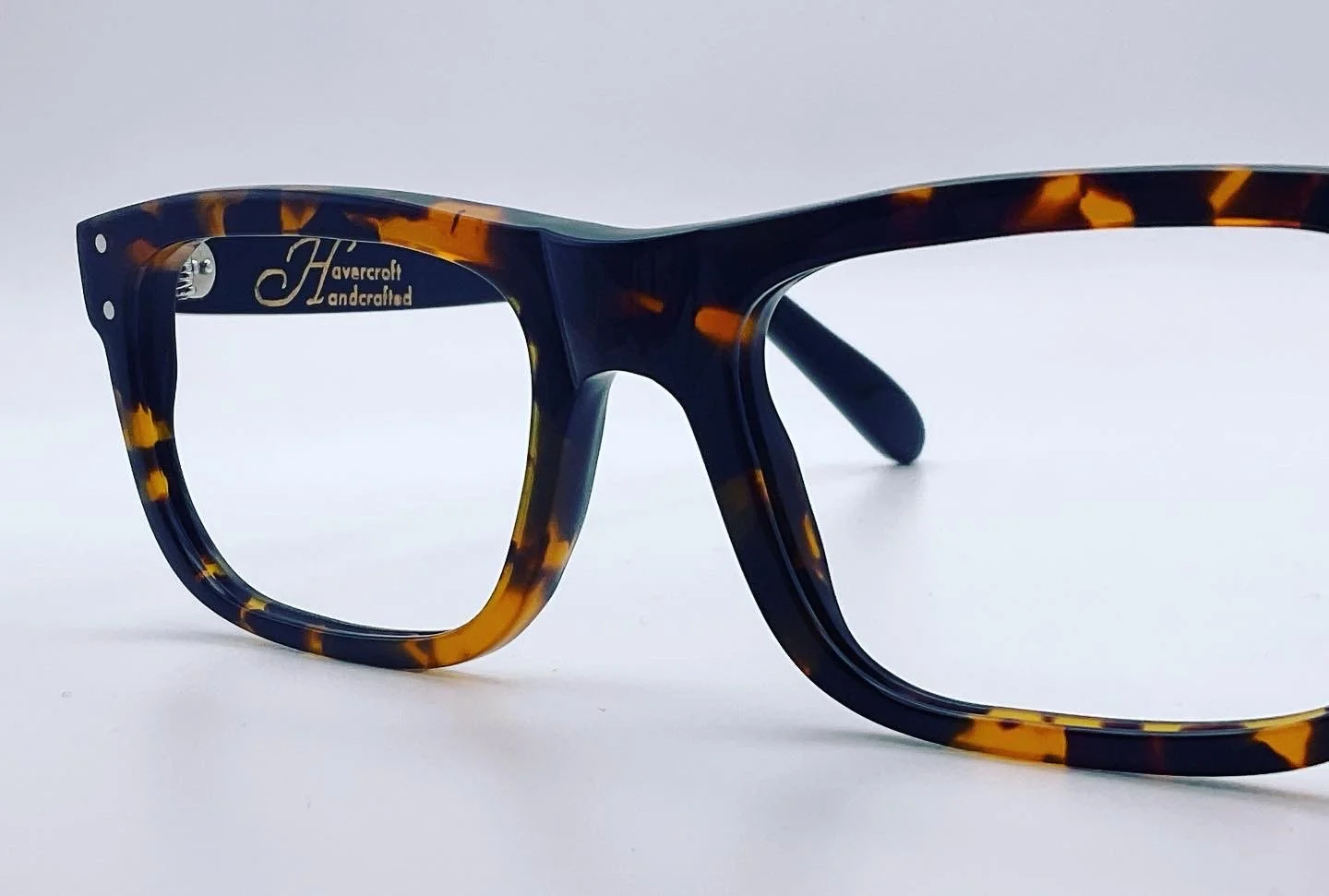 Tortoise-shell patterned eyeglasses with the words 'Havercroft handcrafted' on the inside of the frame.