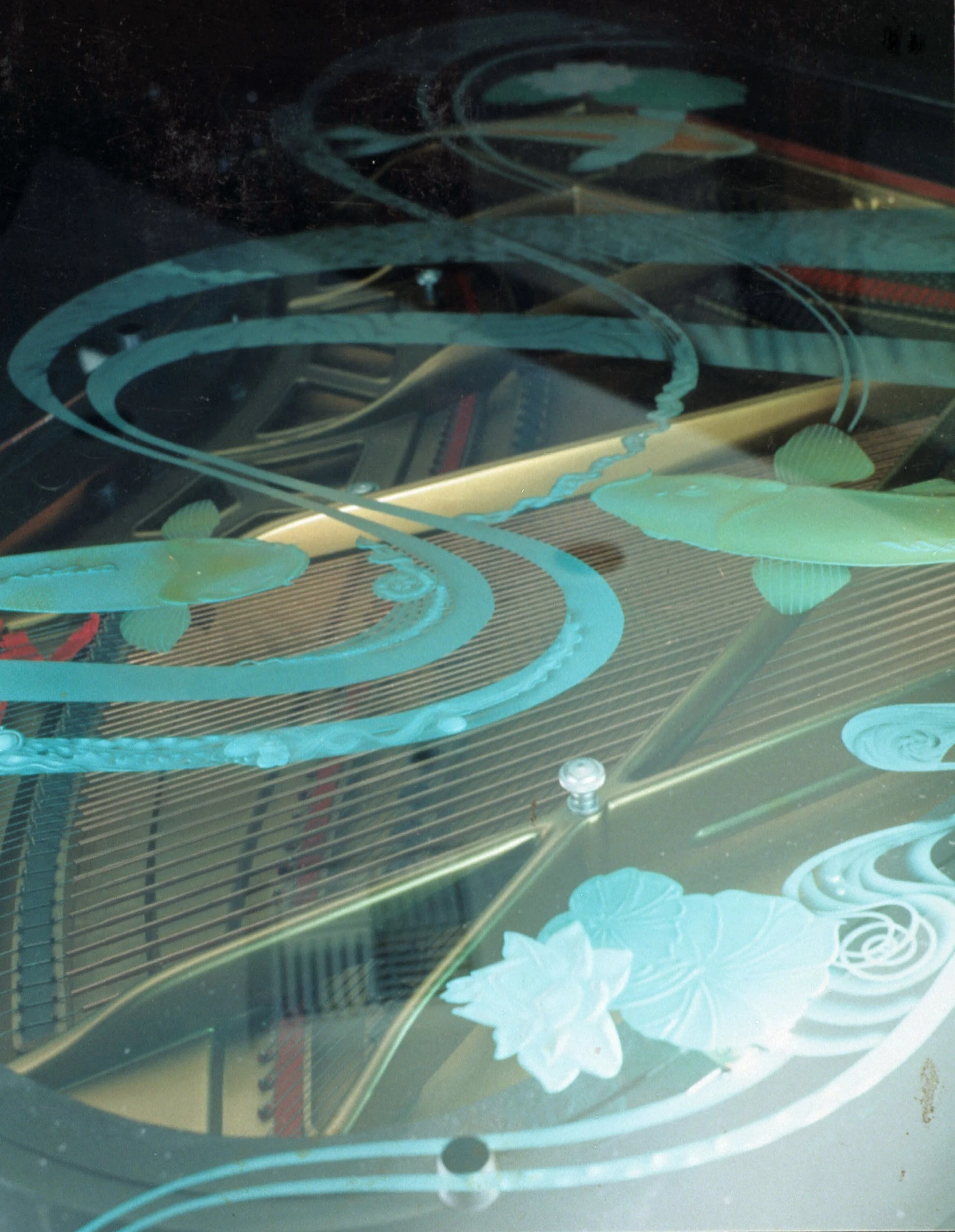 Close-up of Carved Glass Piano Top for 3rd floor Fish Cafe - Seattle, WA