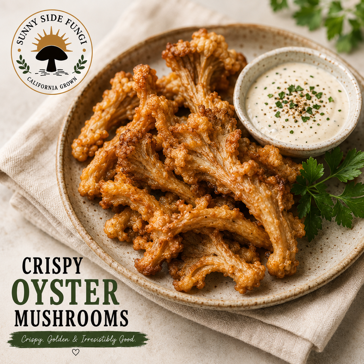Plate of crispy fried oyster mushrooms served with a side of creamy dipping sauce garnished with parsley