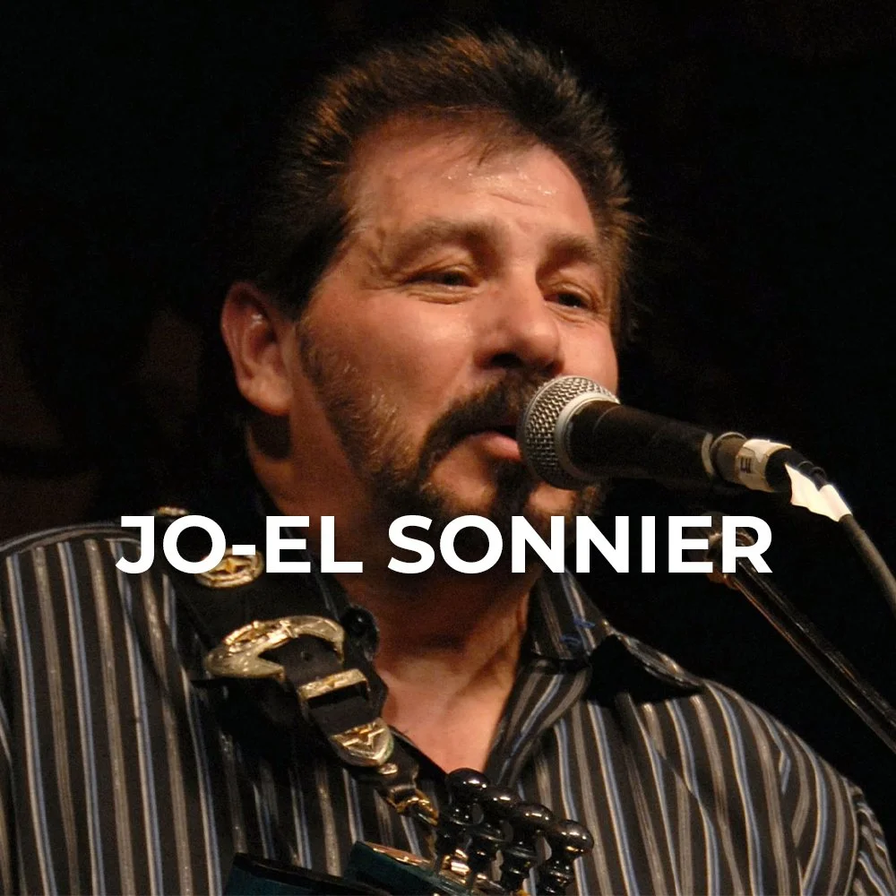 A man singing into a microphone, wearing a black and white striped shirt with large gold and black jewelry around his neck, with the name Jo-El Sonnier written across the image.