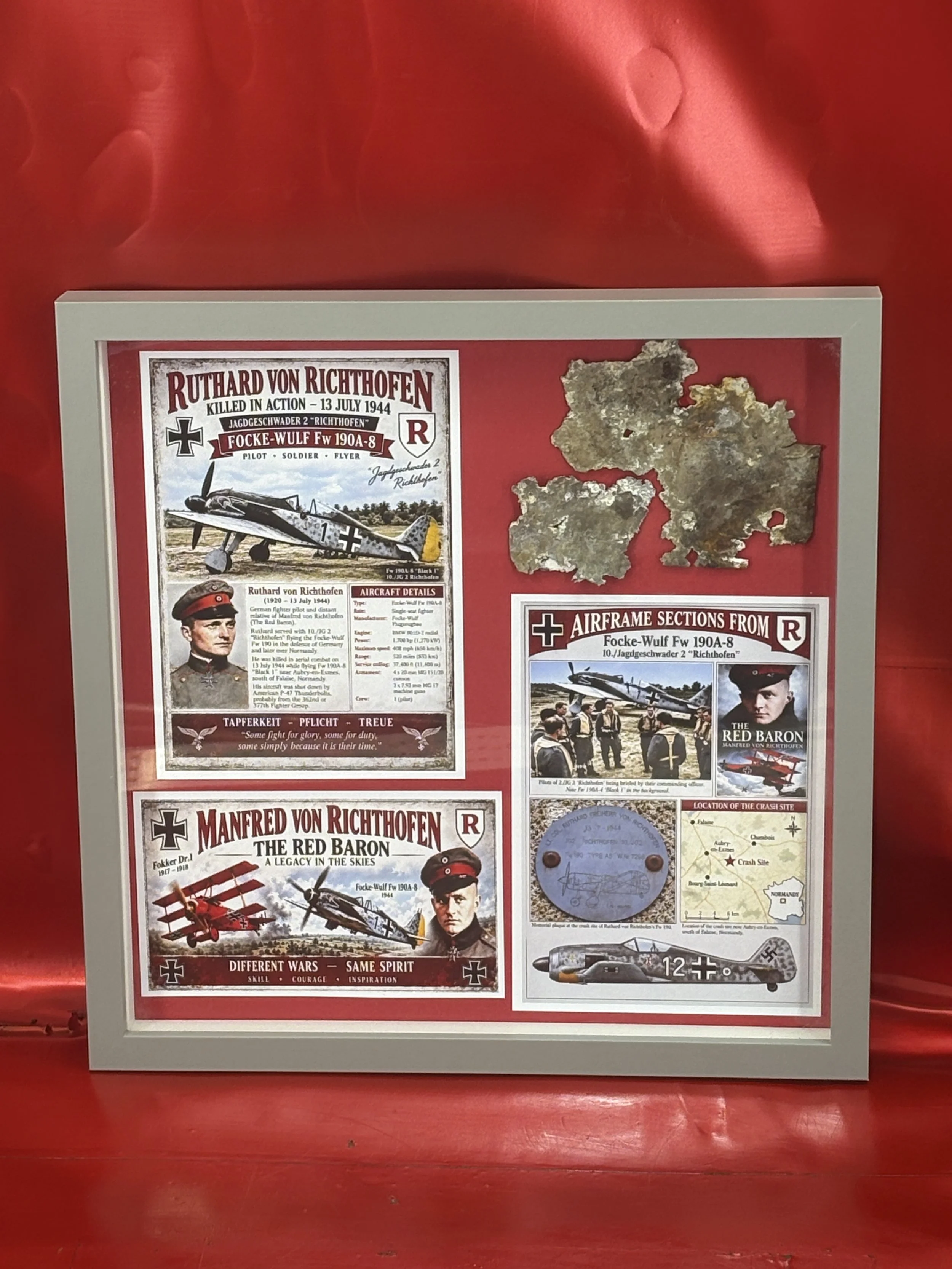 Glass framed airframe sections from German Focke Wulf 190 number 730909 of 10/JG2 the pilot was Ruthard Von Richthofen, shot down by a US P-51 Mustang, 13th July 1944 during the Battle of Normandy