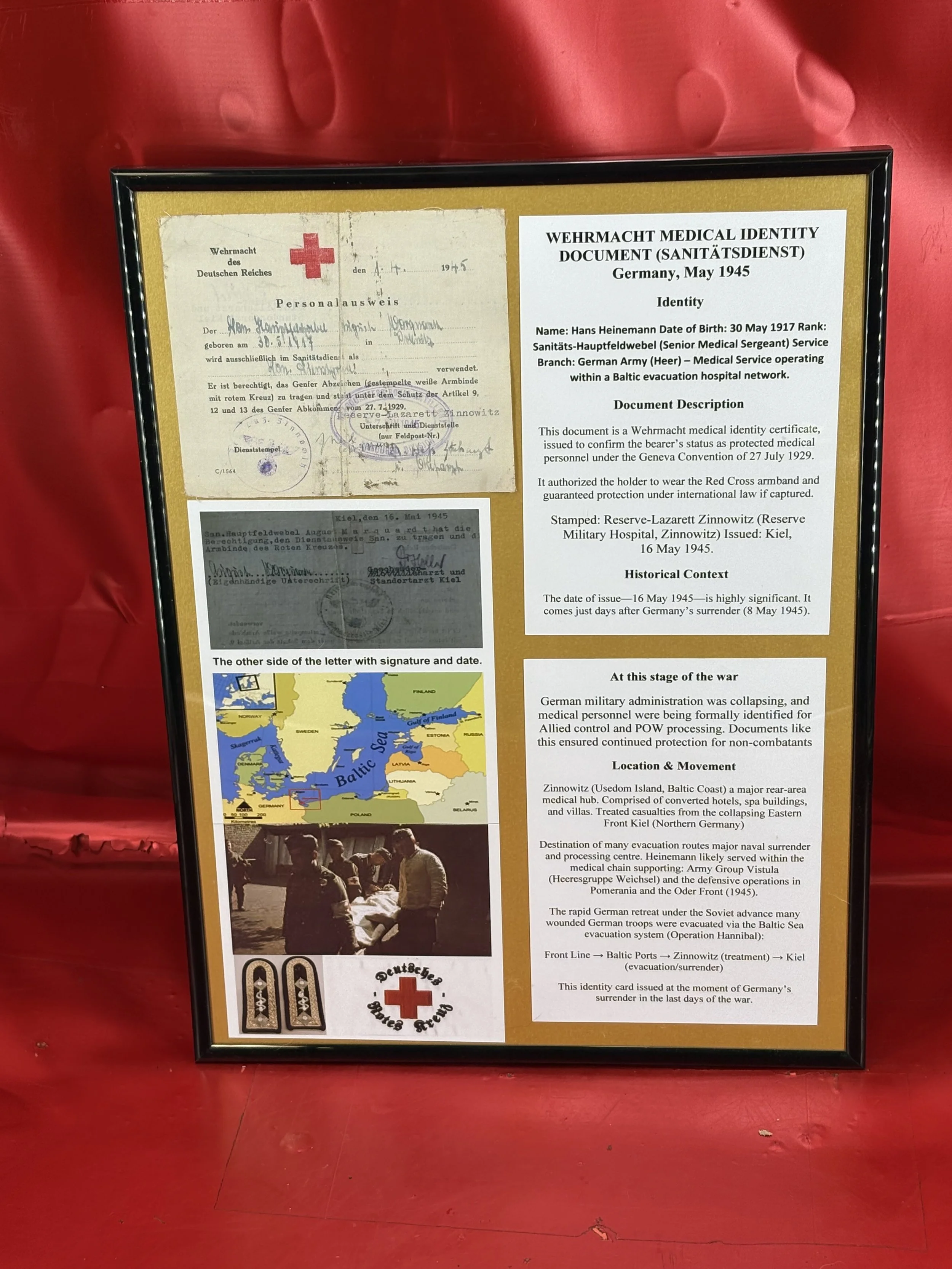 Large perspex framed Wehrmacht medical identity document (sanitatsdienst) used in Germany in May 1945 with stamps and markings,fully translated and researched