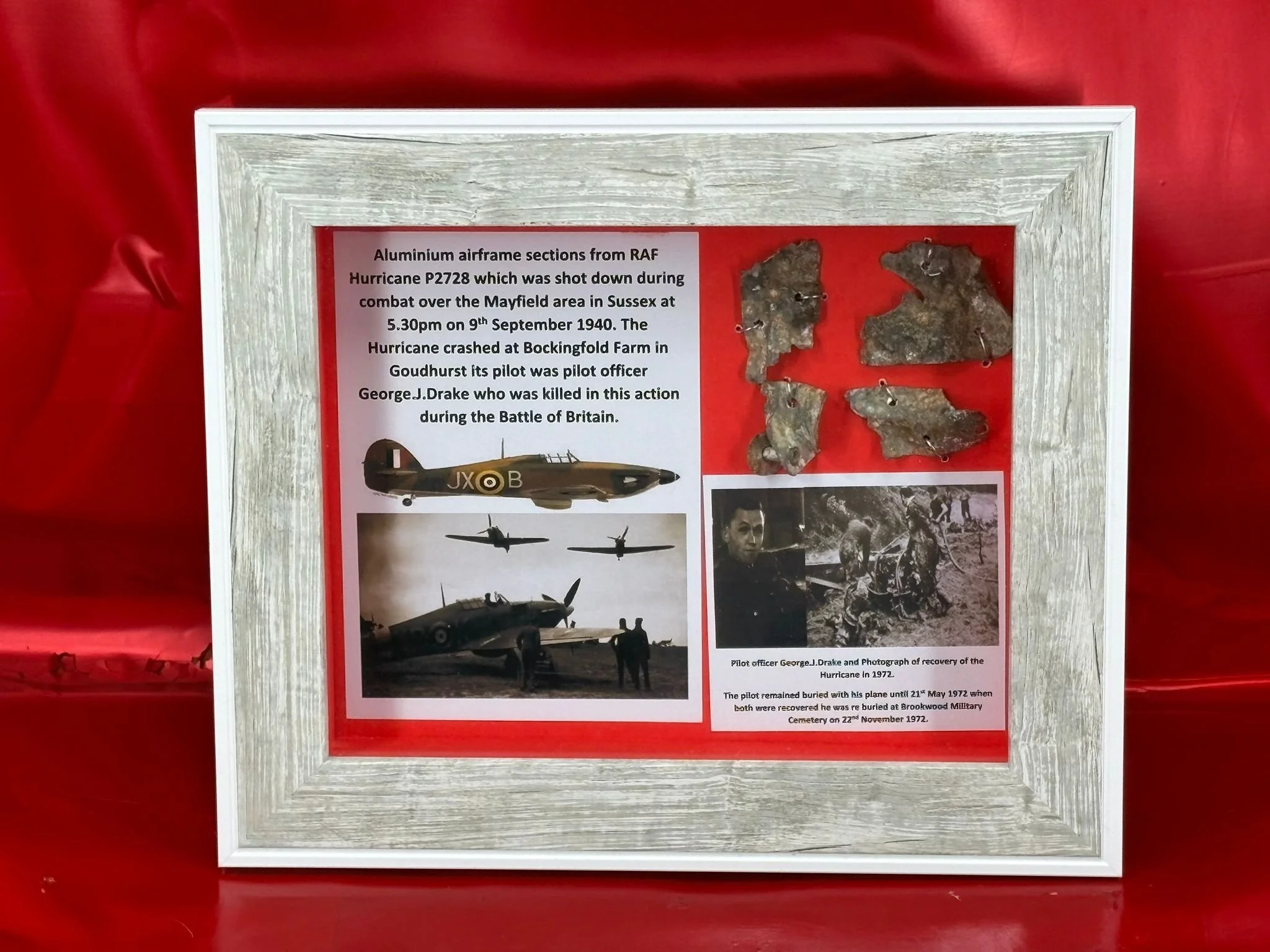 Glass framed display group of airframe and engine parts from RAF Hurricane P2728 shot down over Goudhurst on the 9th September 1940 during the battle of Britain.