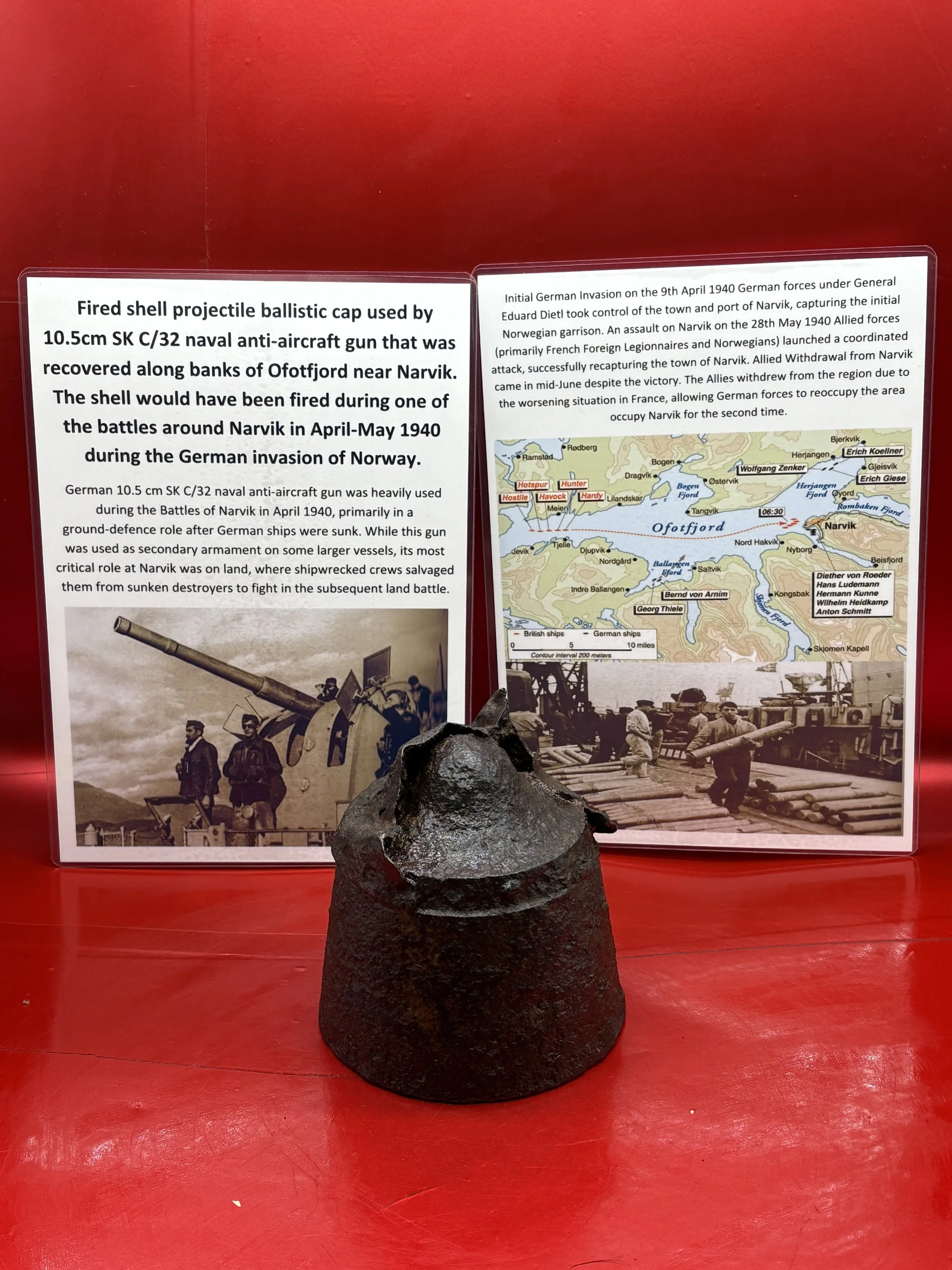 A fired shell projectile ballistic cap on German 10.5cm SK C/32 naval anti-aircraft gun used in ground fighting, recovered along banks of Ofotfjord near Narvik from battle of 1940 during the invasion