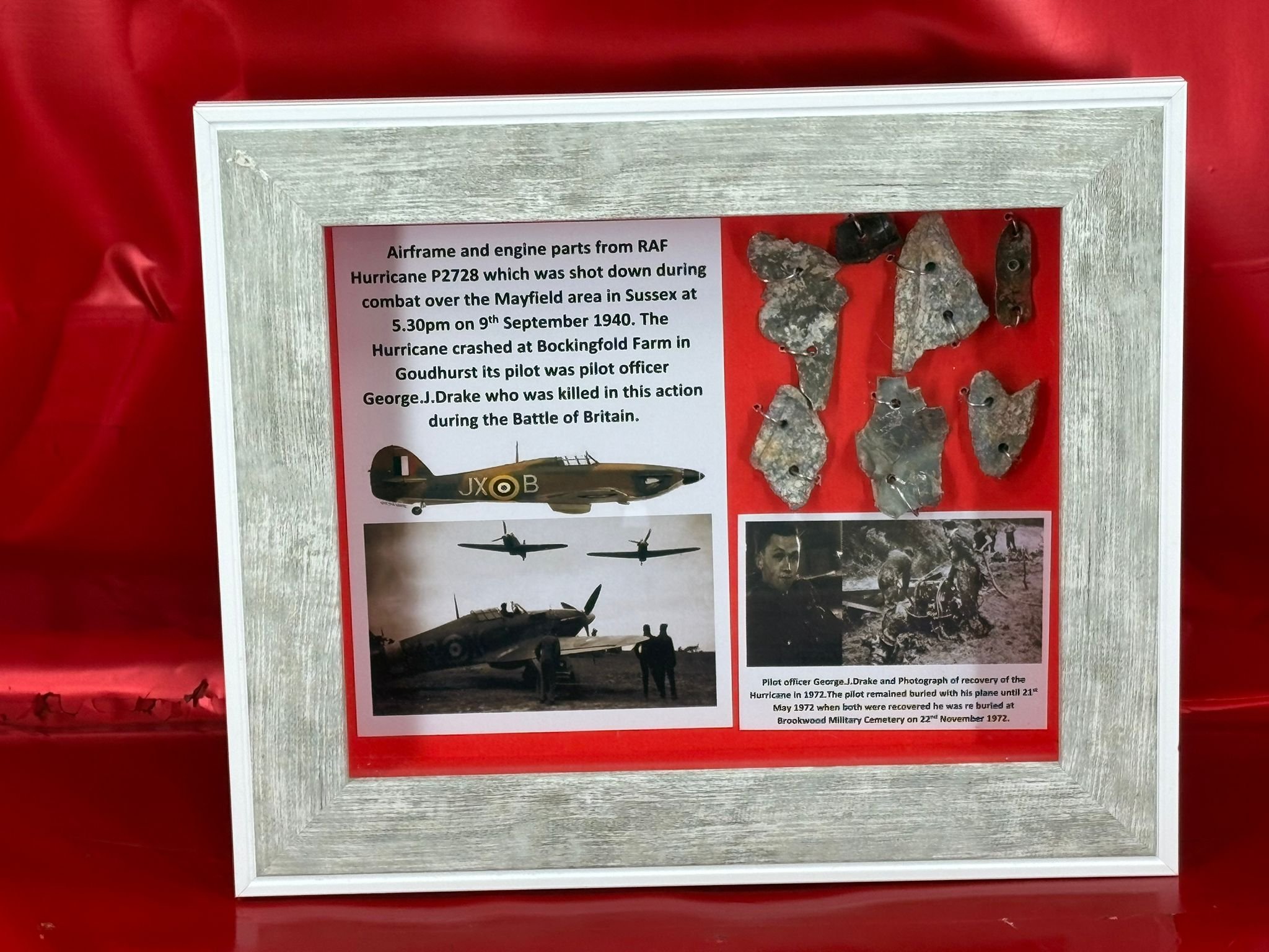 Glass framed display group of airframe and engine parts from RAF Hurricane P2728 shot down over Goudhurst on the 9th September 1940 during the battle of Britain.