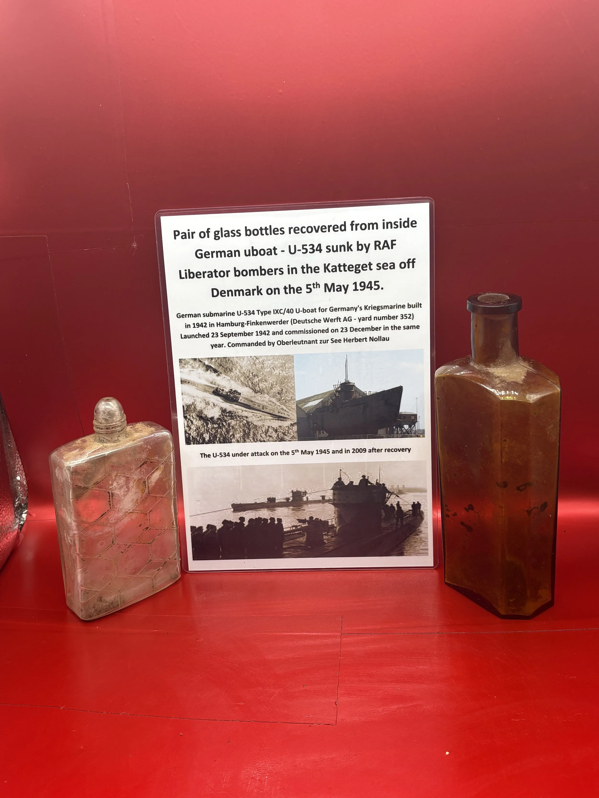 Pair of glass bottles both maker marked from inside U534 which was sunk by RAF Liberator bombers in the Katteget sea off Denmark on the 5th May 1945